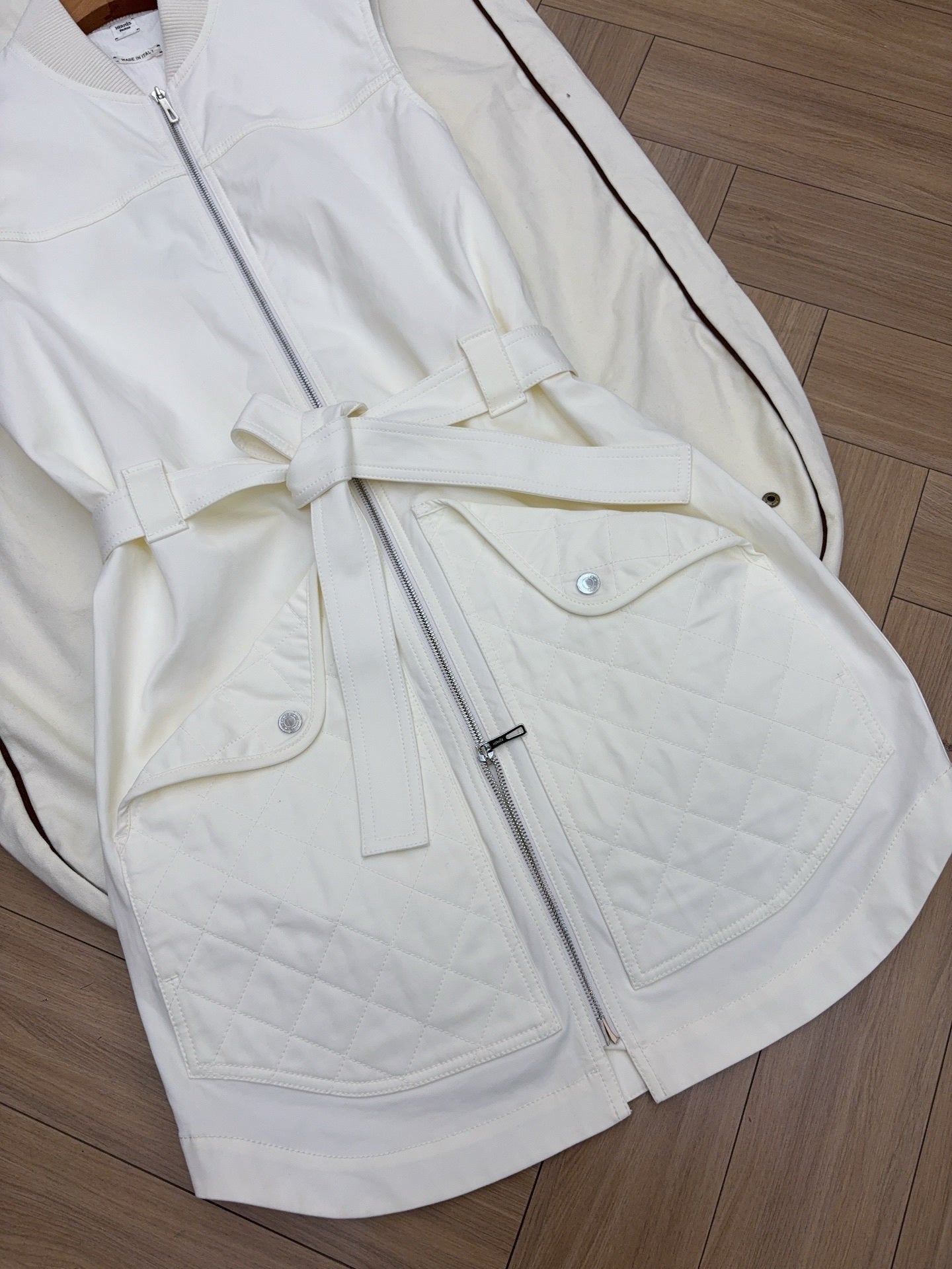 QUILTED ZIP-FRONT SLEEVELESS VEST WITH BELTED DETAIL