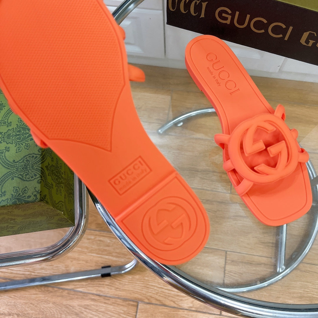 NEON ORANGE RUBBER SLIDE SANDALS WITH ROUND EMBLEM