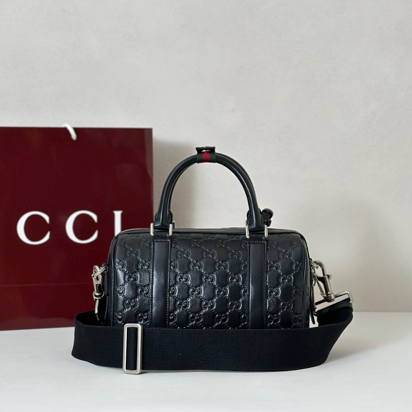 EMBOSSED LEATHER TOP HANDLE BAG