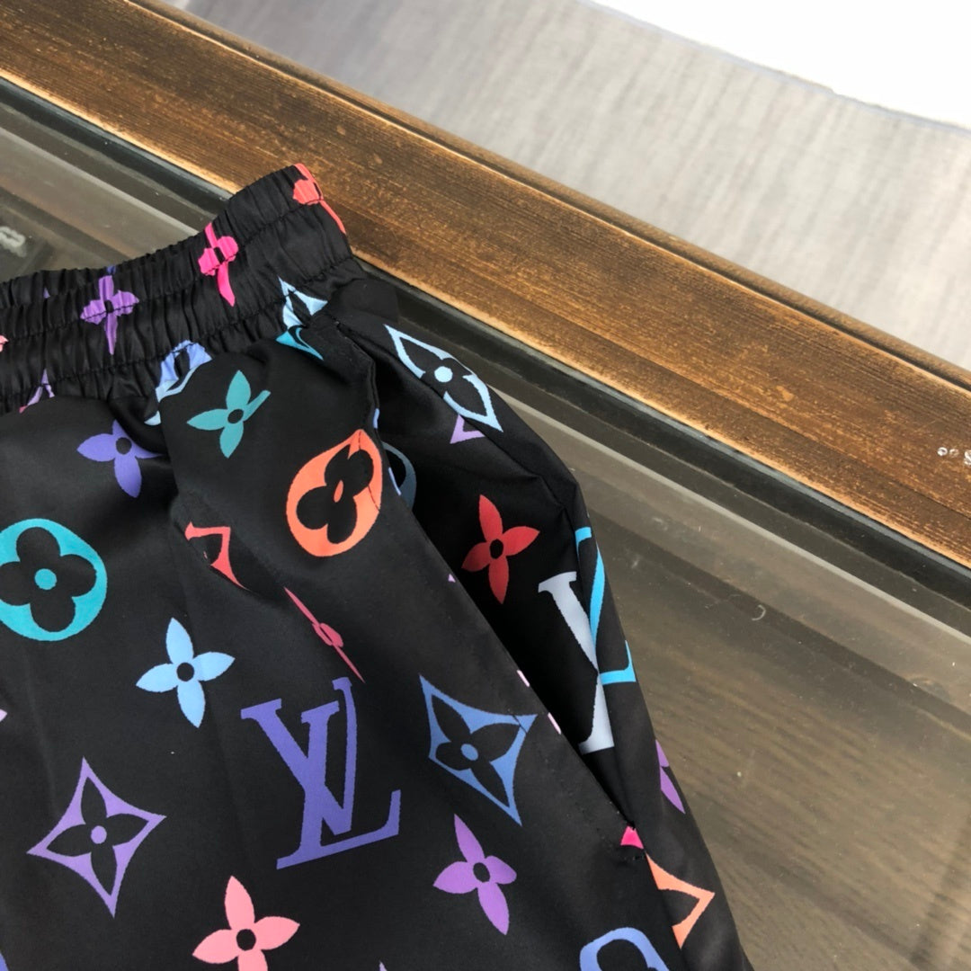 BLACK MULTICOLOR PRINT SWIM SHORTS