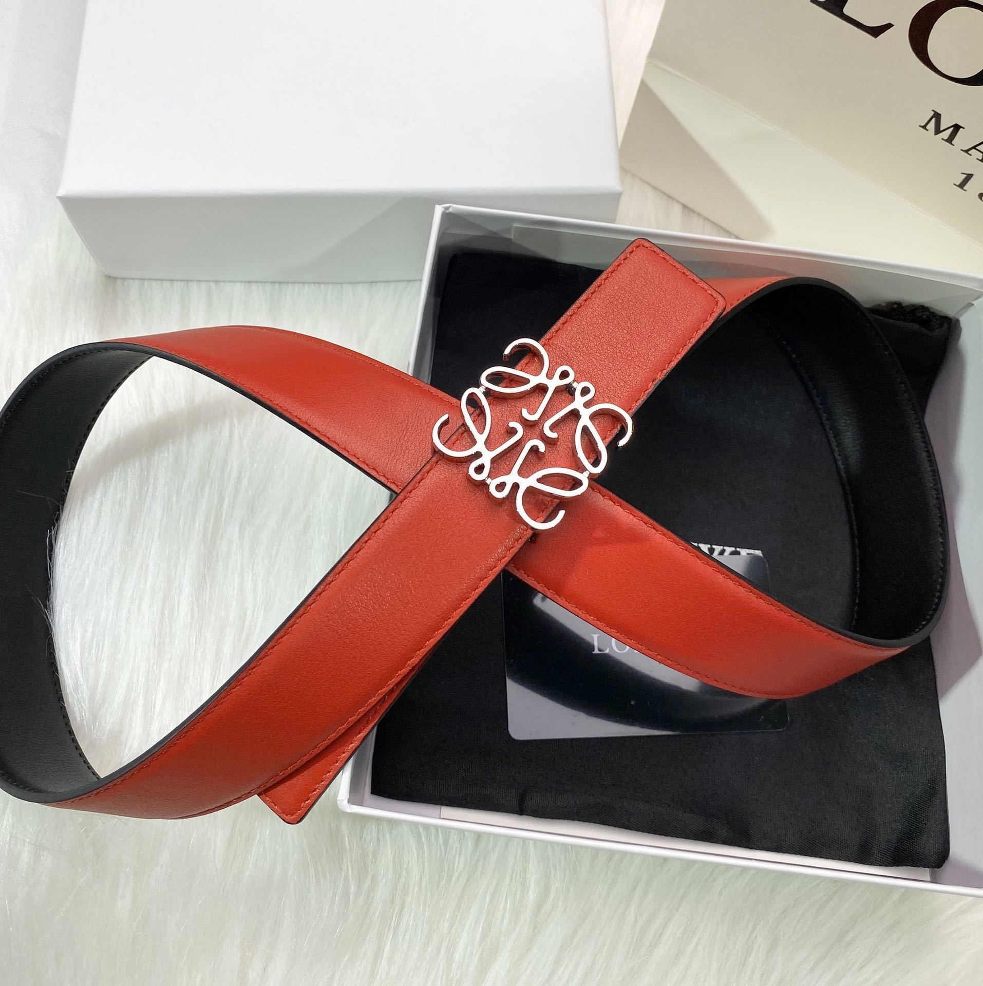RED LEATHER BELT WITH SILVER ANAGRAM BUCKLE