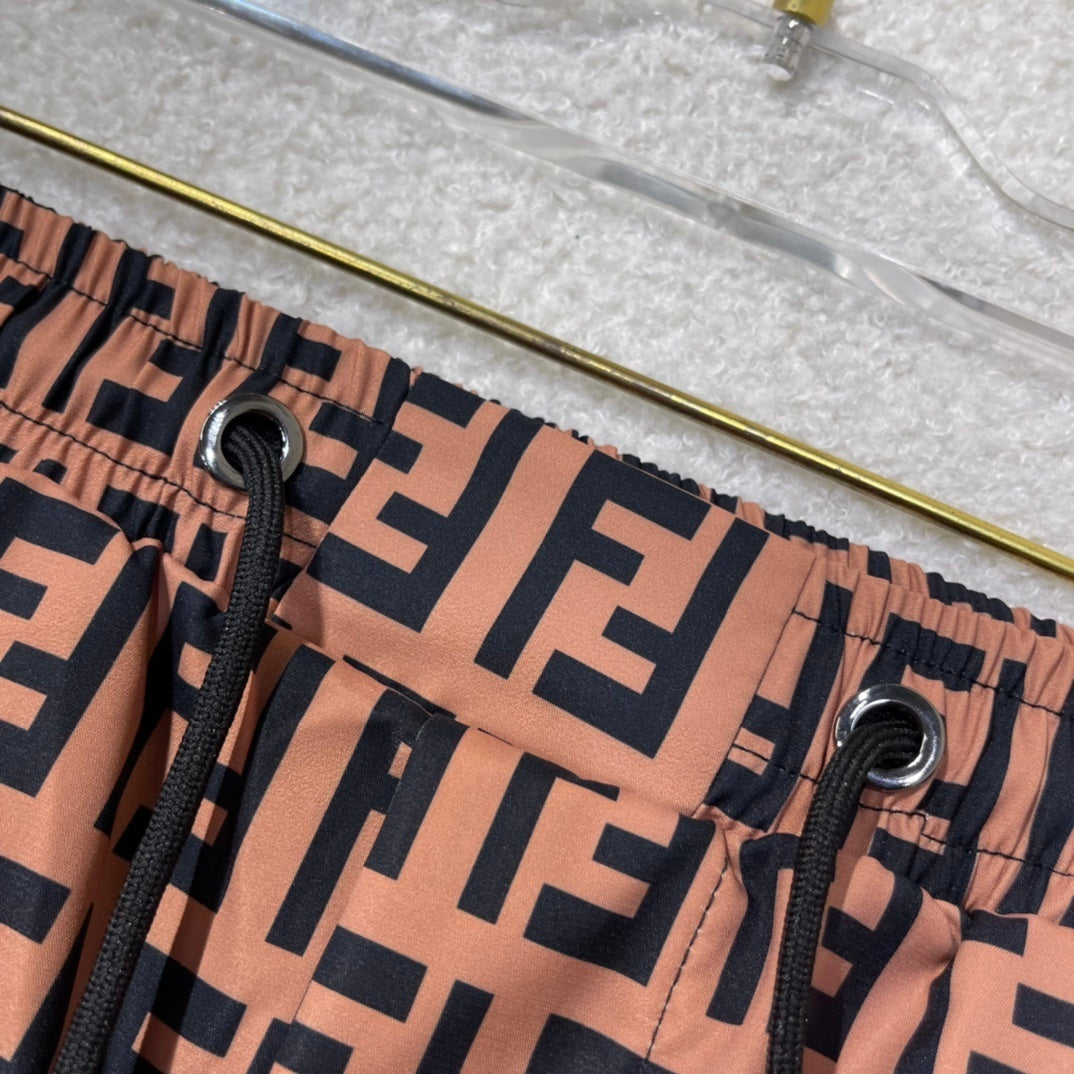 MONOGRAM SWIM SHORTS – BROWN