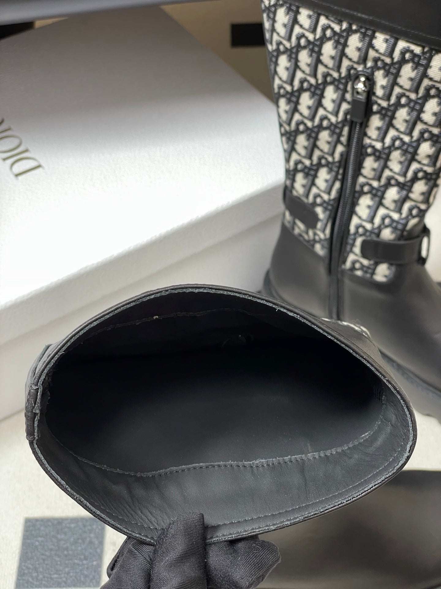 BLACK MID-CALF BOOTS WITH MONOGRAM FABRIC PANEL AND BUCKLE DETAIL