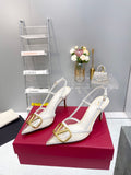 CLEAR SLINGBACK HEELS – ELEGANT WHITE WITH GOLD LOGO DETAIL