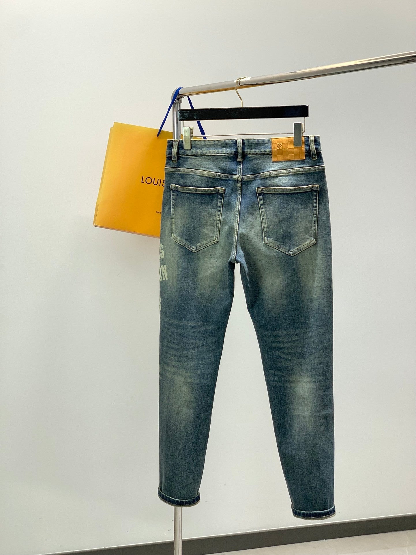 DISTRESSED SLIM-FIT GRAPHIC DENIM JEANS