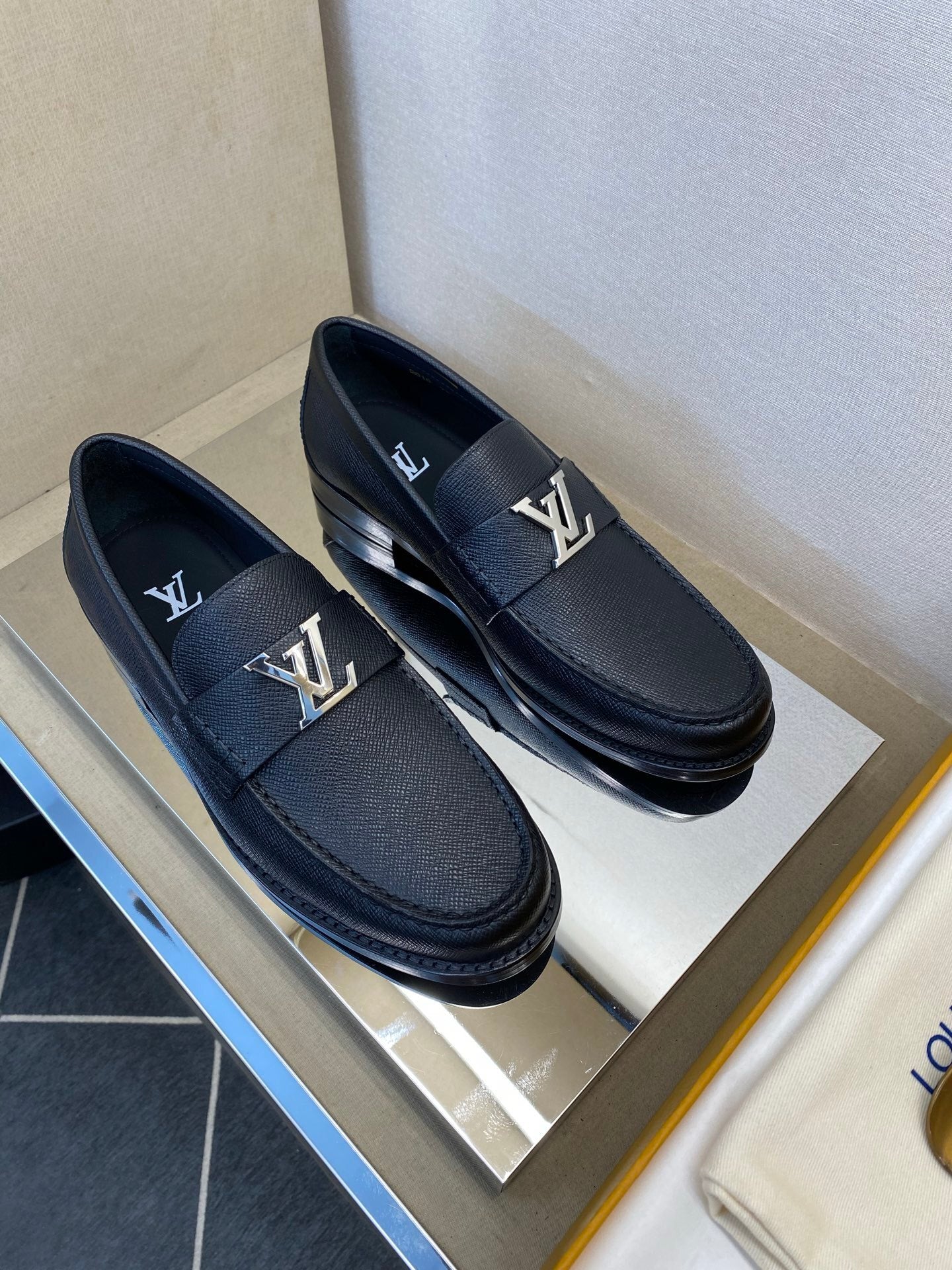 BLACK LEATHER SLIP-ON LOAFERS WITH METAL DETAIL