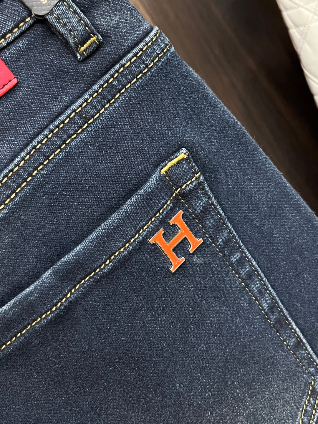 DARK DENIM JEANS WITH SIGNATURE RED ACCENT PATCH