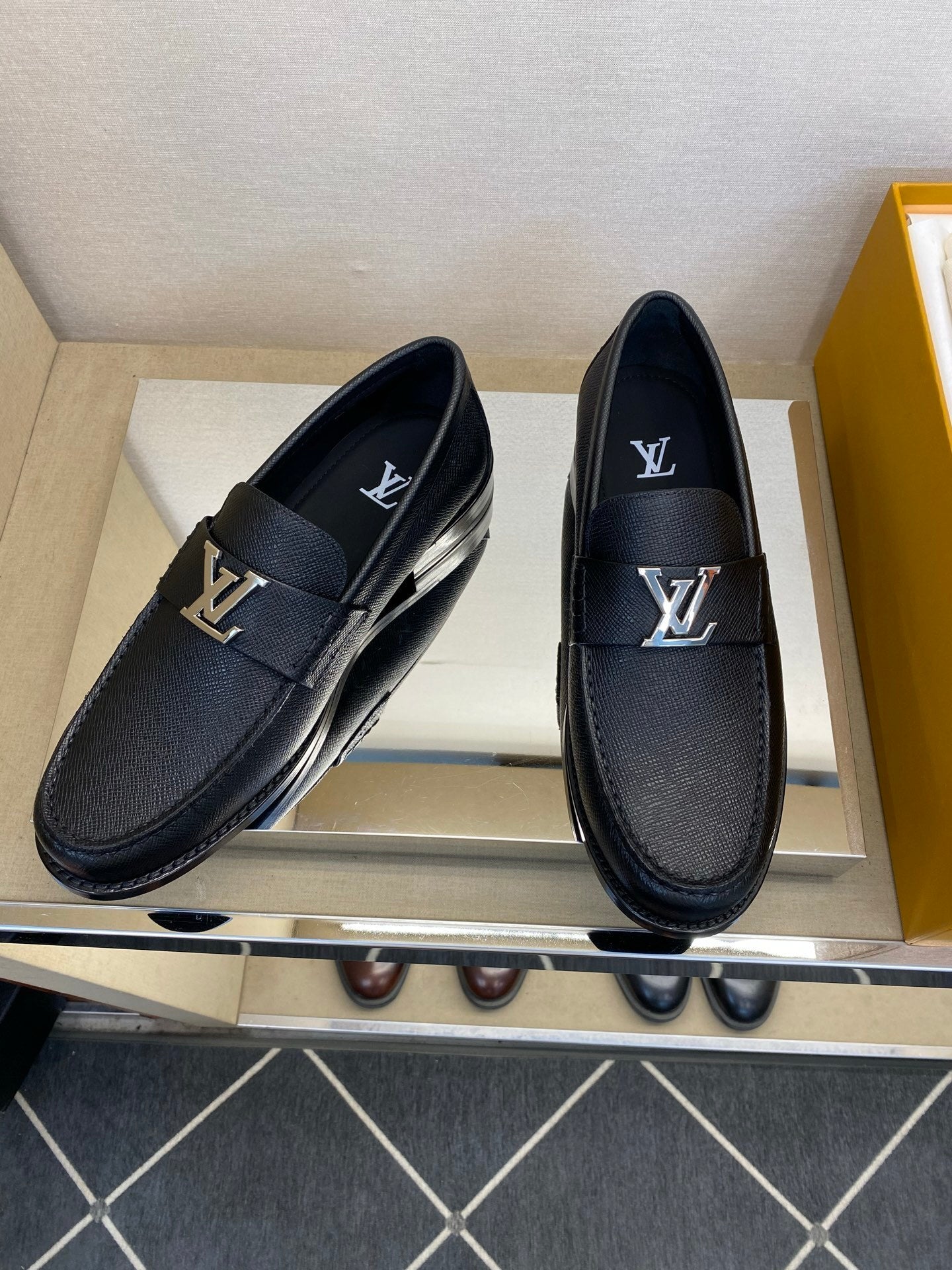 BLACK LEATHER SLIP-ON LOAFERS WITH METAL DETAIL