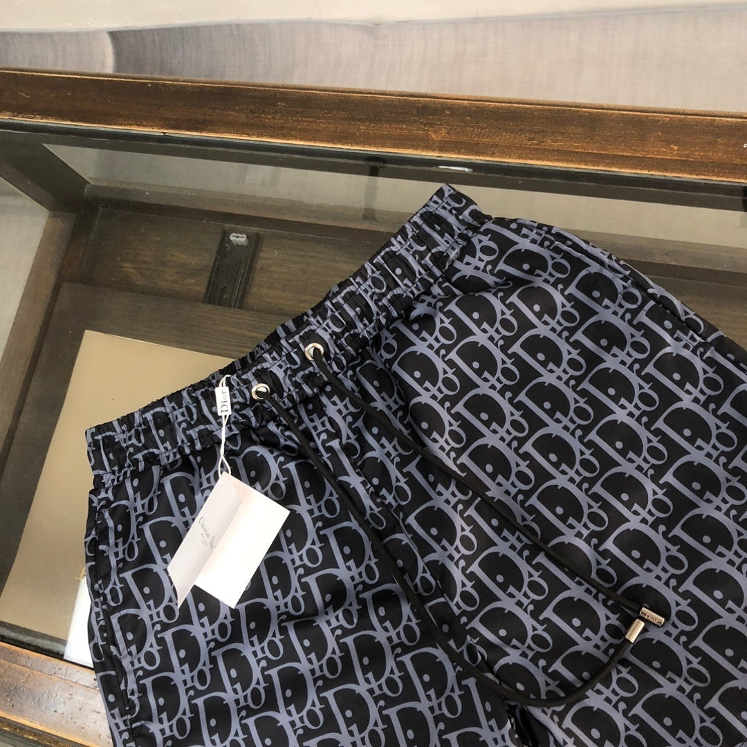 BLUE MONOGRAM PRINT SWIM SHORTS