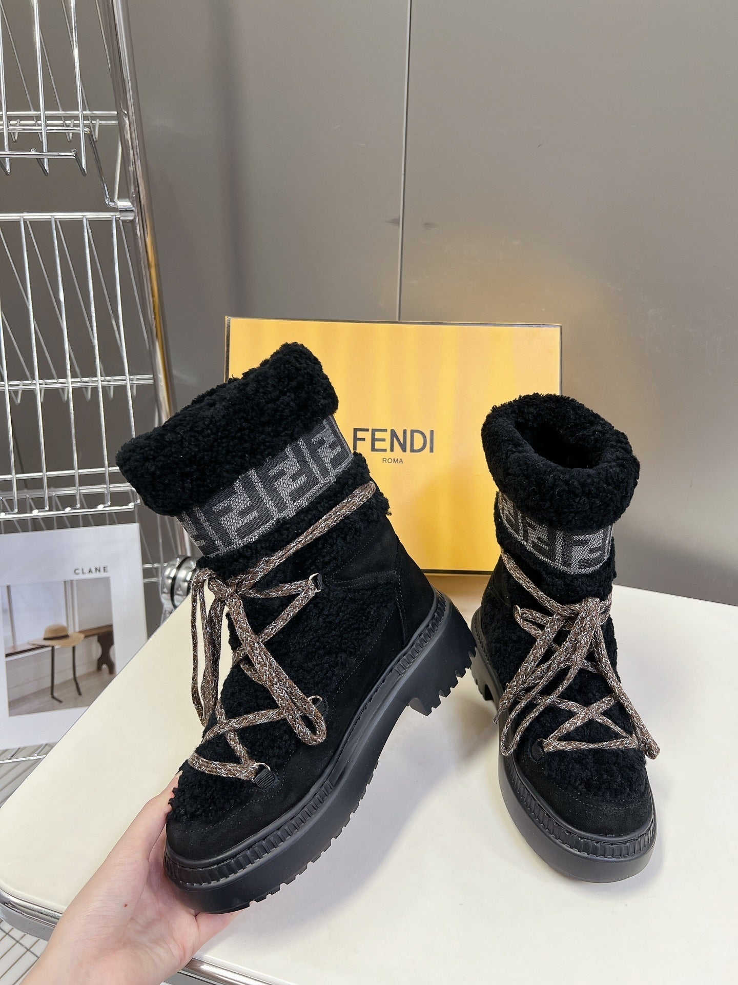 BLACK SHERPA-LINED LACE-UP WINTER BOOTS
