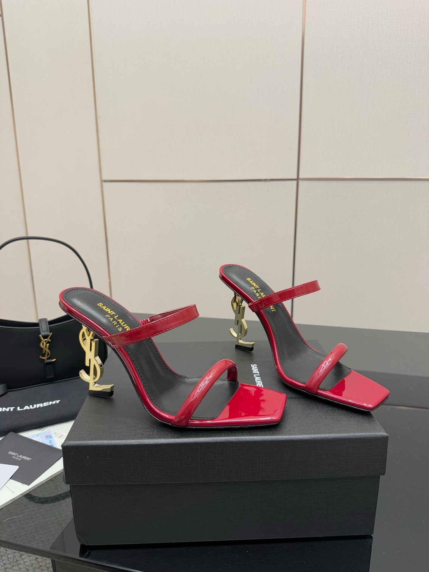 GLOSSY RED STRAPPY HEELS WITH GOLD LOGO HEEL