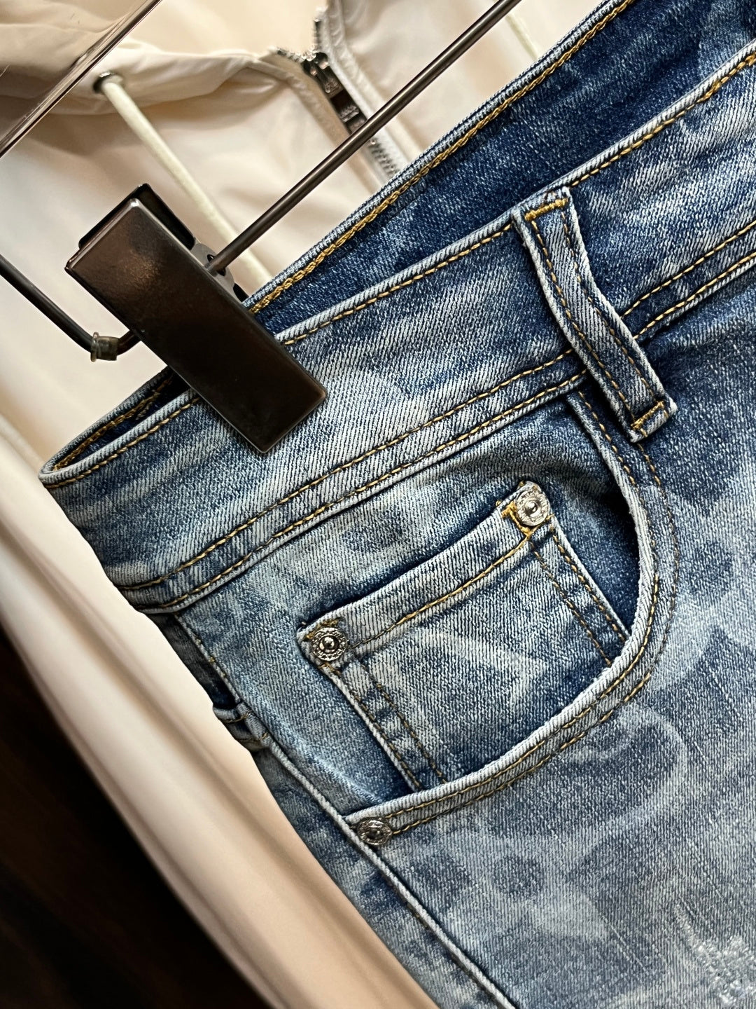 BLUE WASHED DENIM JEANS WITH MONOGRAM PATTERN