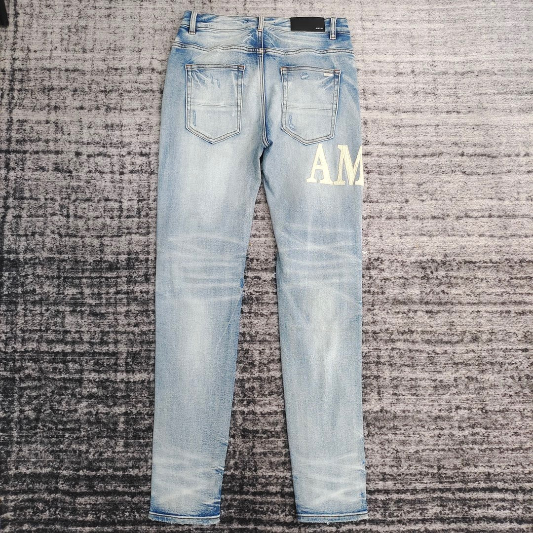 DISTRESSED LOGO PATCH SKINNY JEANS