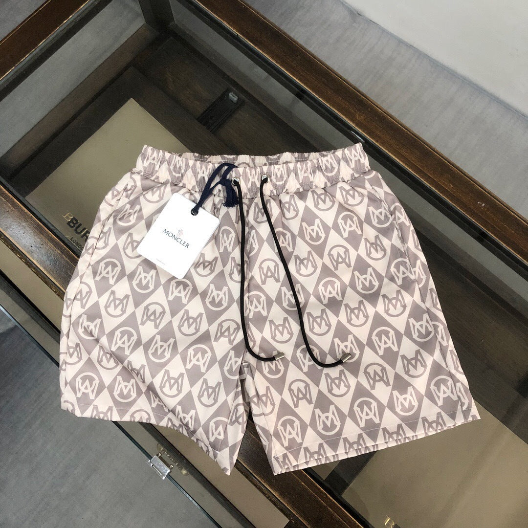 MONOGRAM PRINT SWIM SHORTS