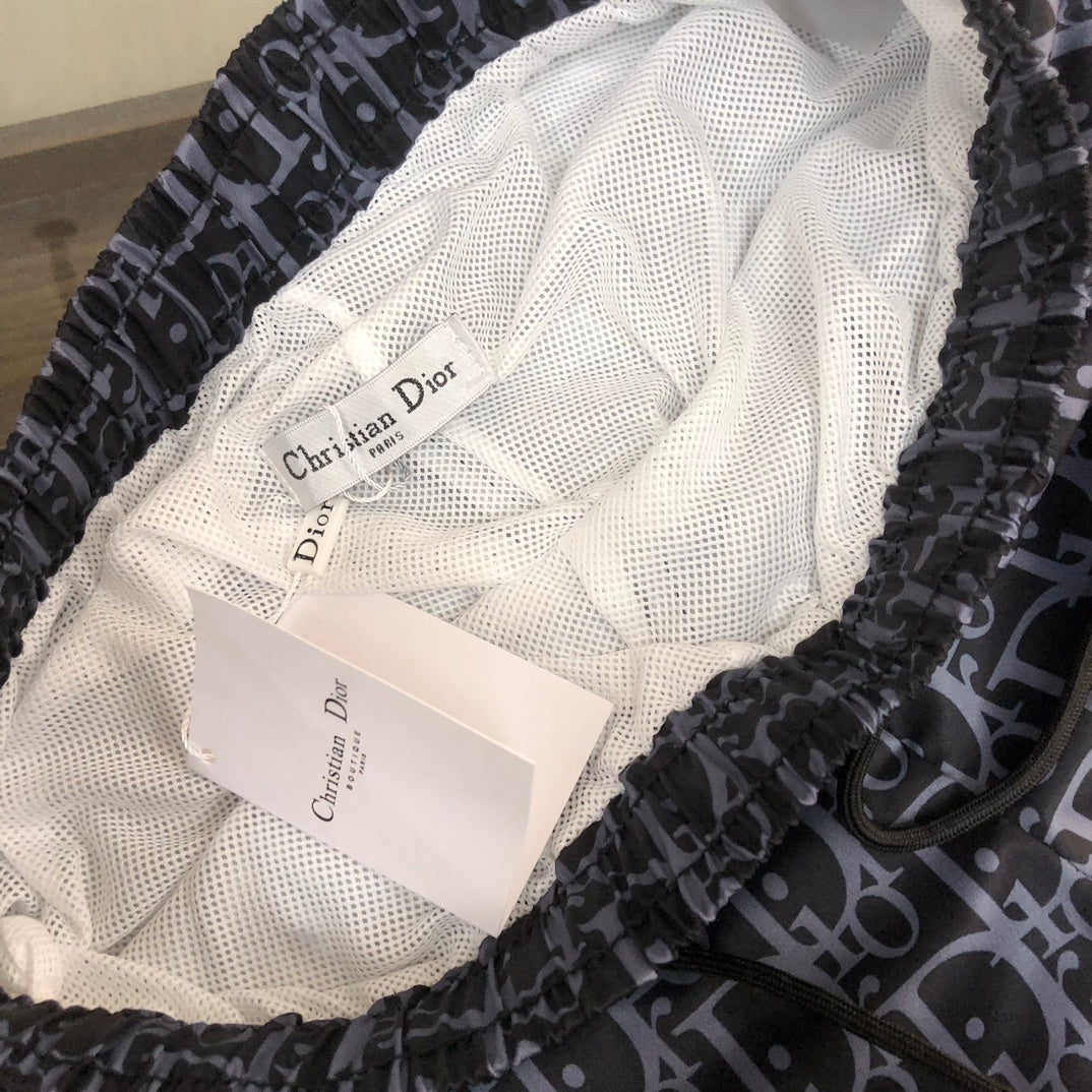 BLUE MONOGRAM PRINT SWIM SHORTS