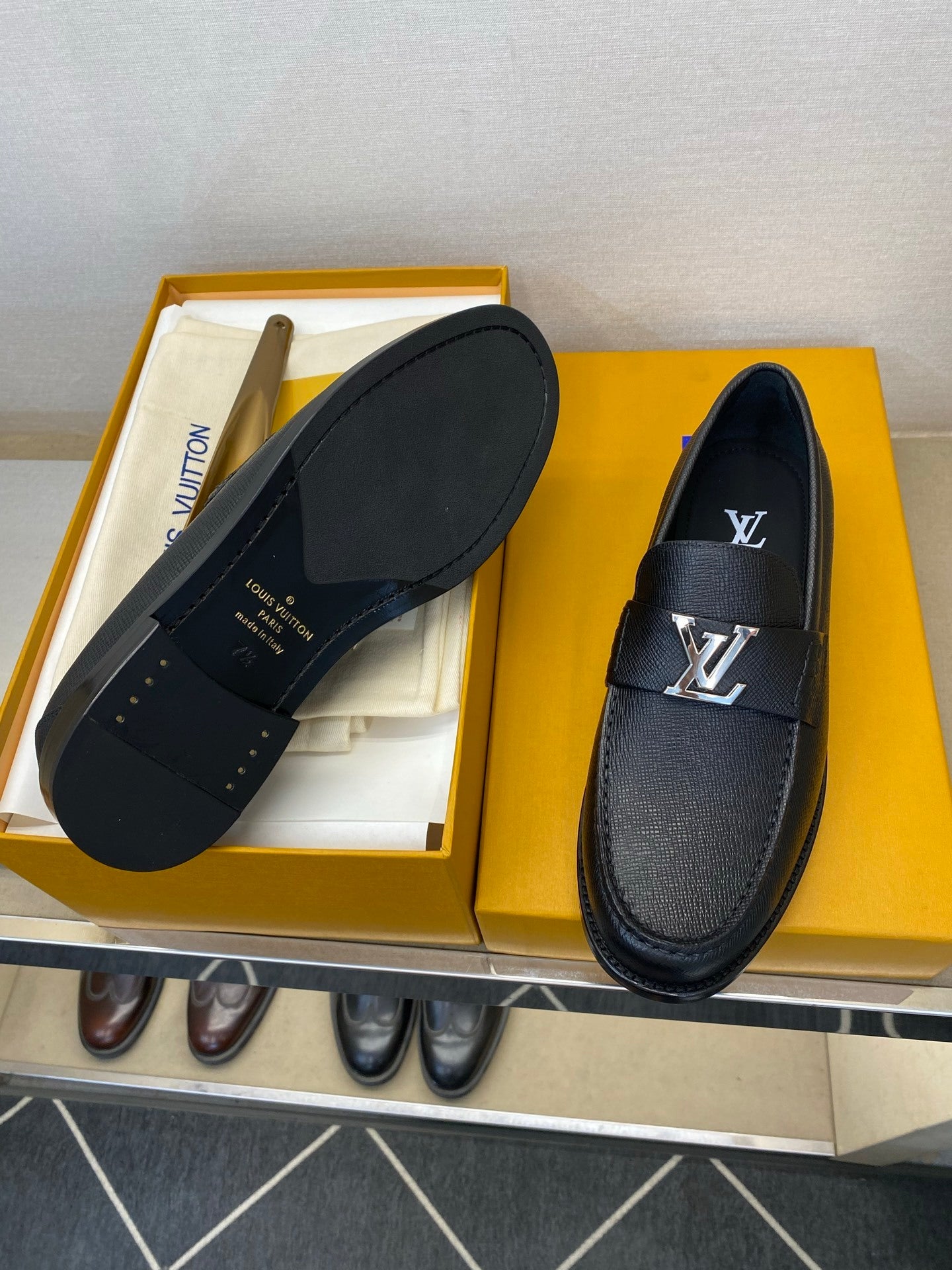 BLACK LEATHER SLIP-ON LOAFERS WITH METAL DETAIL