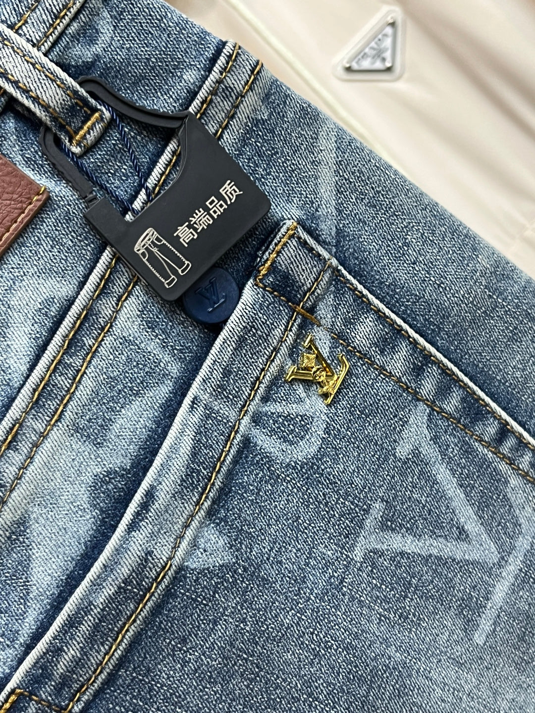 BLUE WASHED DENIM JEANS WITH MONOGRAM PATTERN