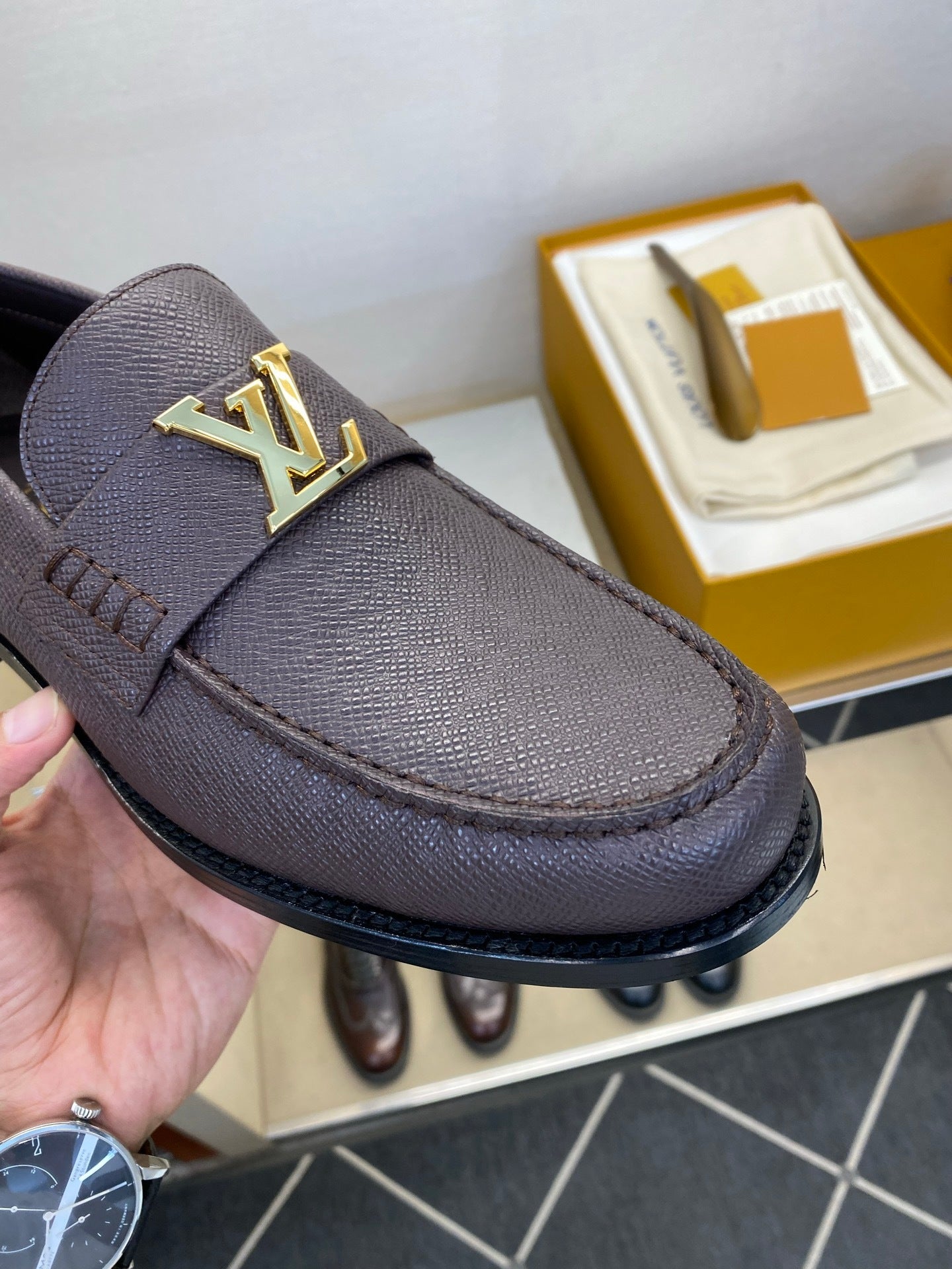 BROWN LEATHER SLIP-ON LOAFERS WITH GOLD-TONE ACCENT