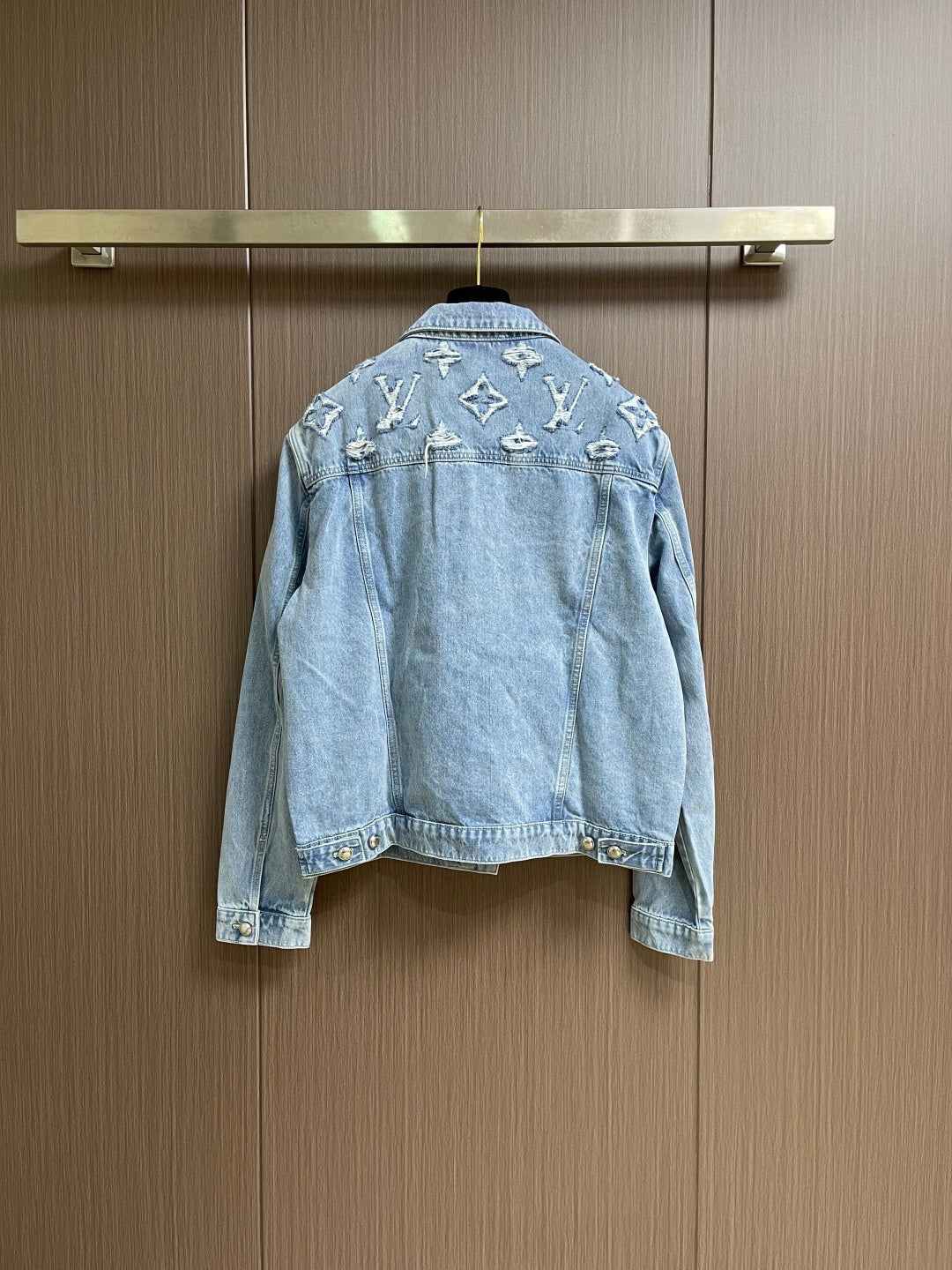 DISTRESSED DENIM TRUCKER JACKET WITH EMBROIDERED DETAILS