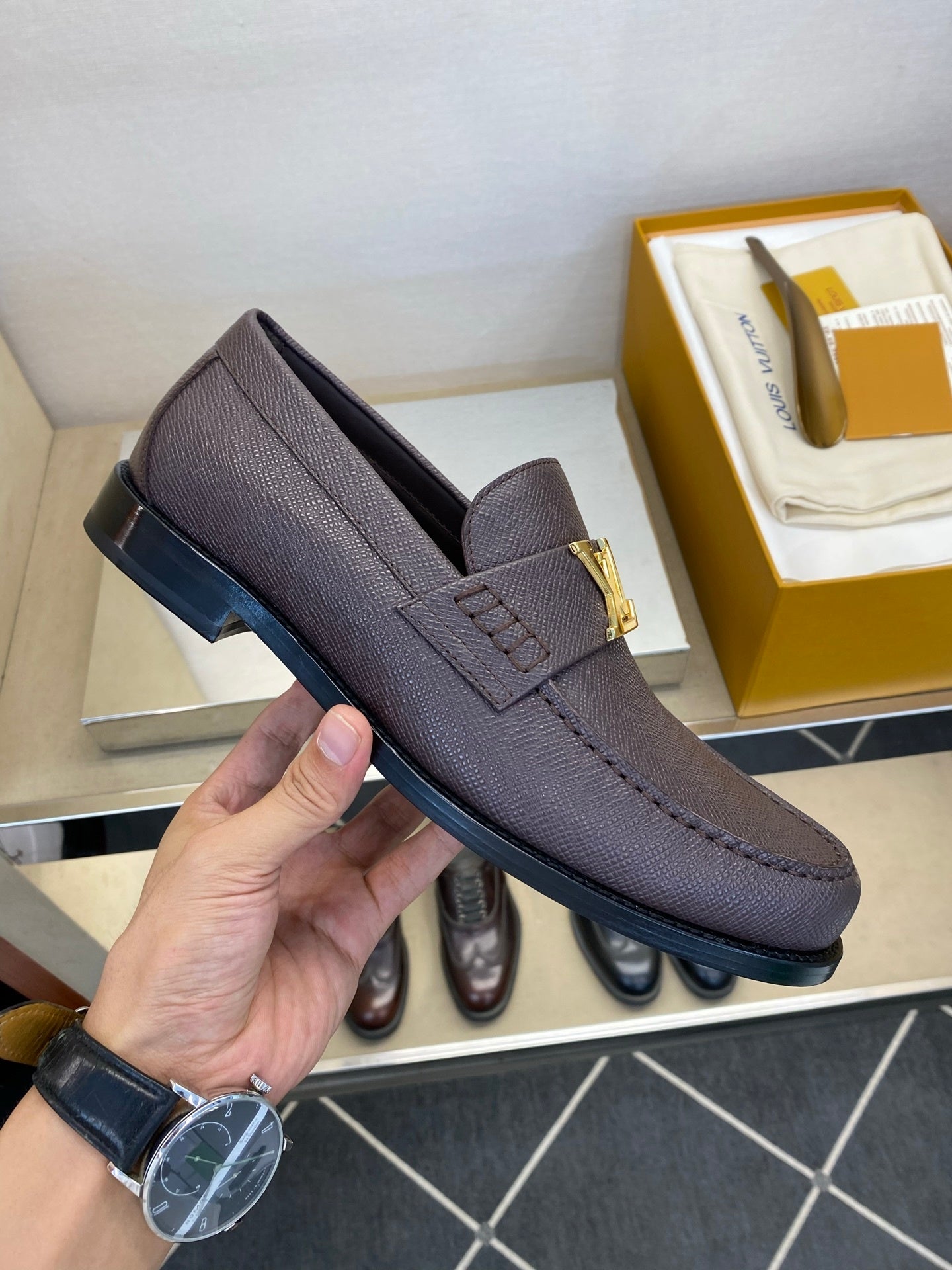 BROWN LEATHER SLIP-ON LOAFERS WITH GOLD-TONE ACCENT