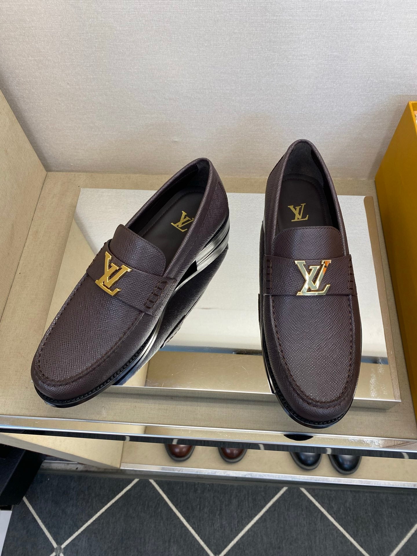 BROWN LEATHER SLIP-ON LOAFERS WITH GOLD-TONE ACCENT