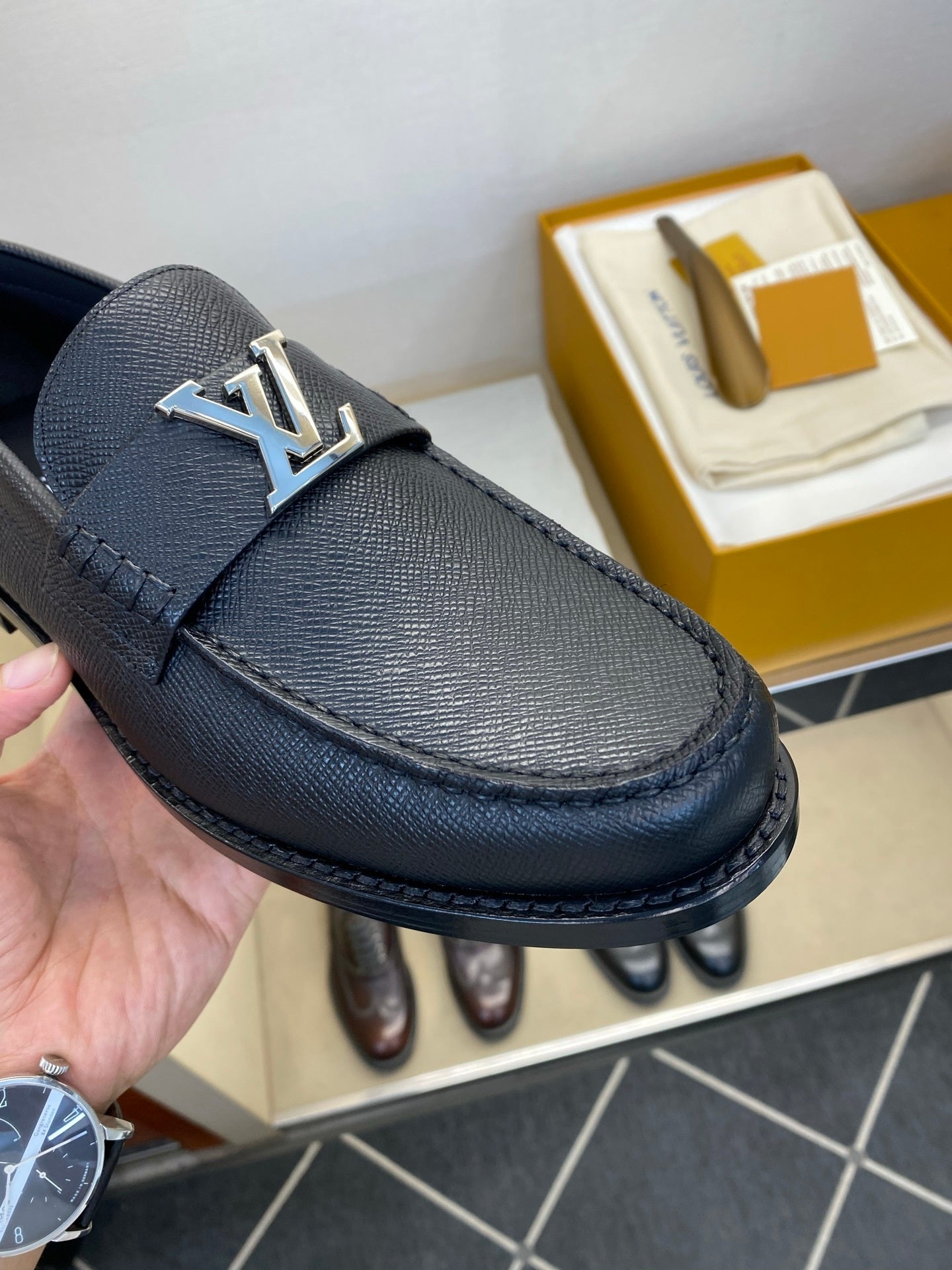 BLACK LEATHER SLIP-ON LOAFERS WITH METAL DETAIL