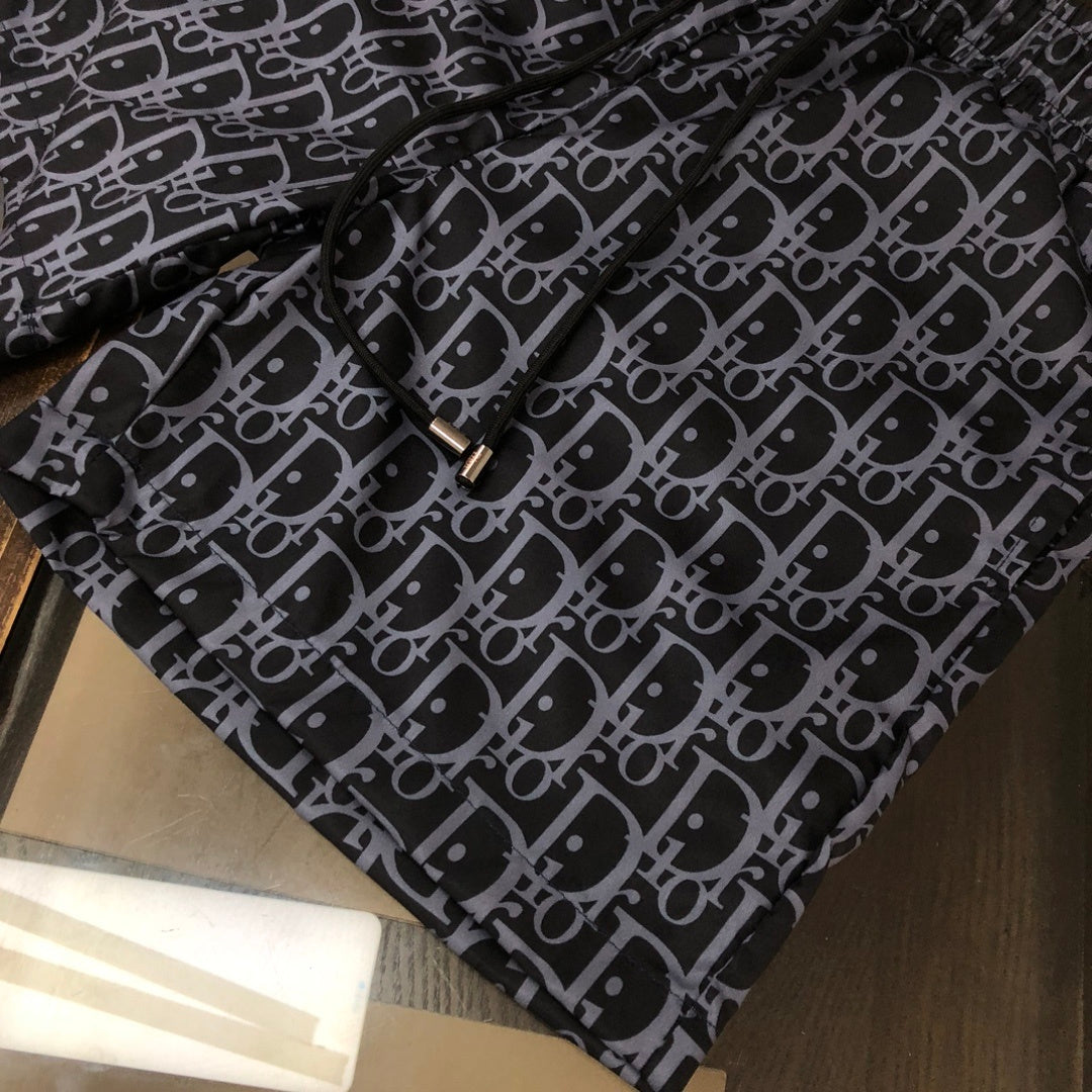 BLUE MONOGRAM PRINT SWIM SHORTS