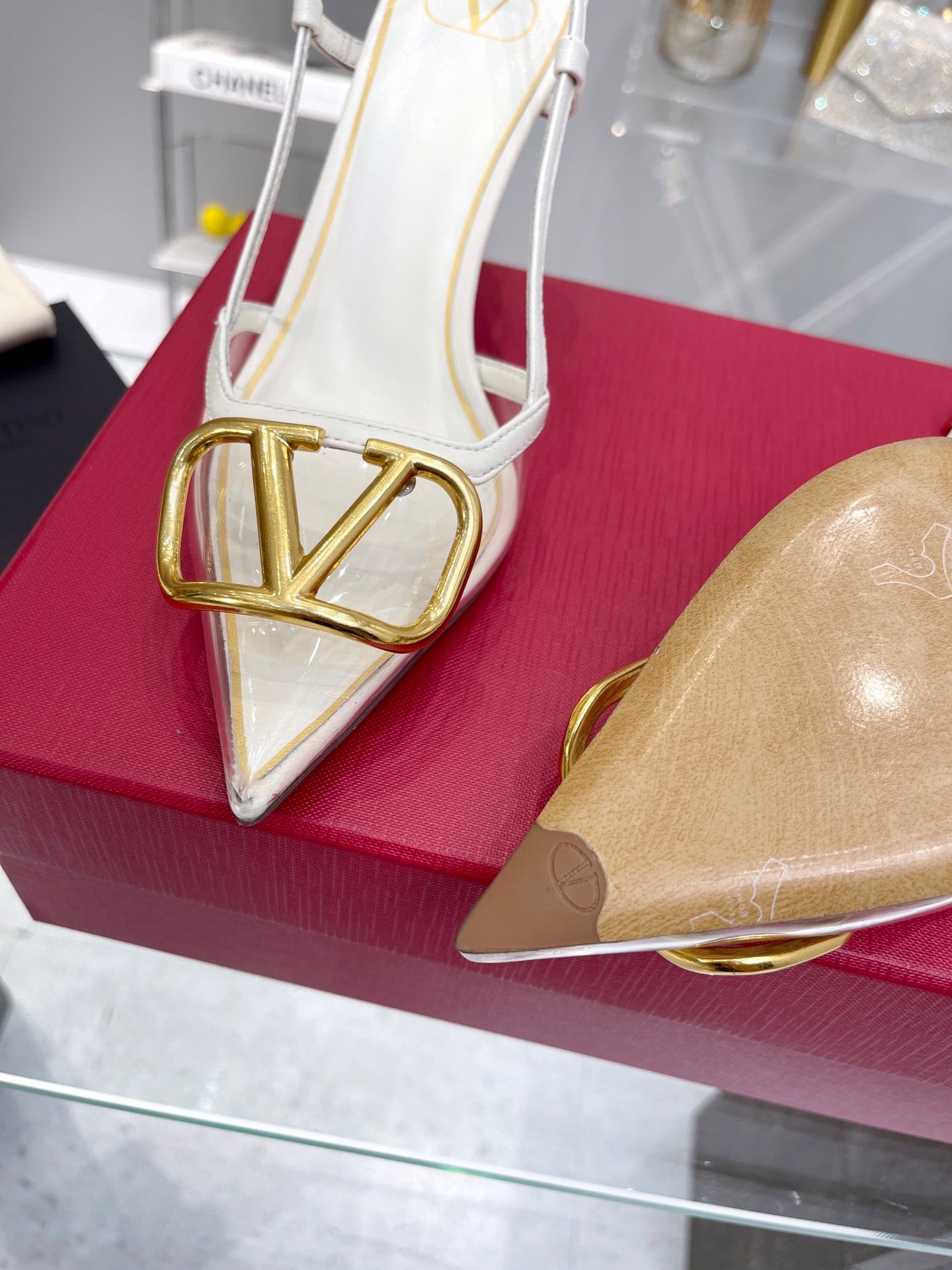 CLEAR SLINGBACK HEELS – ELEGANT WHITE WITH GOLD LOGO DETAIL