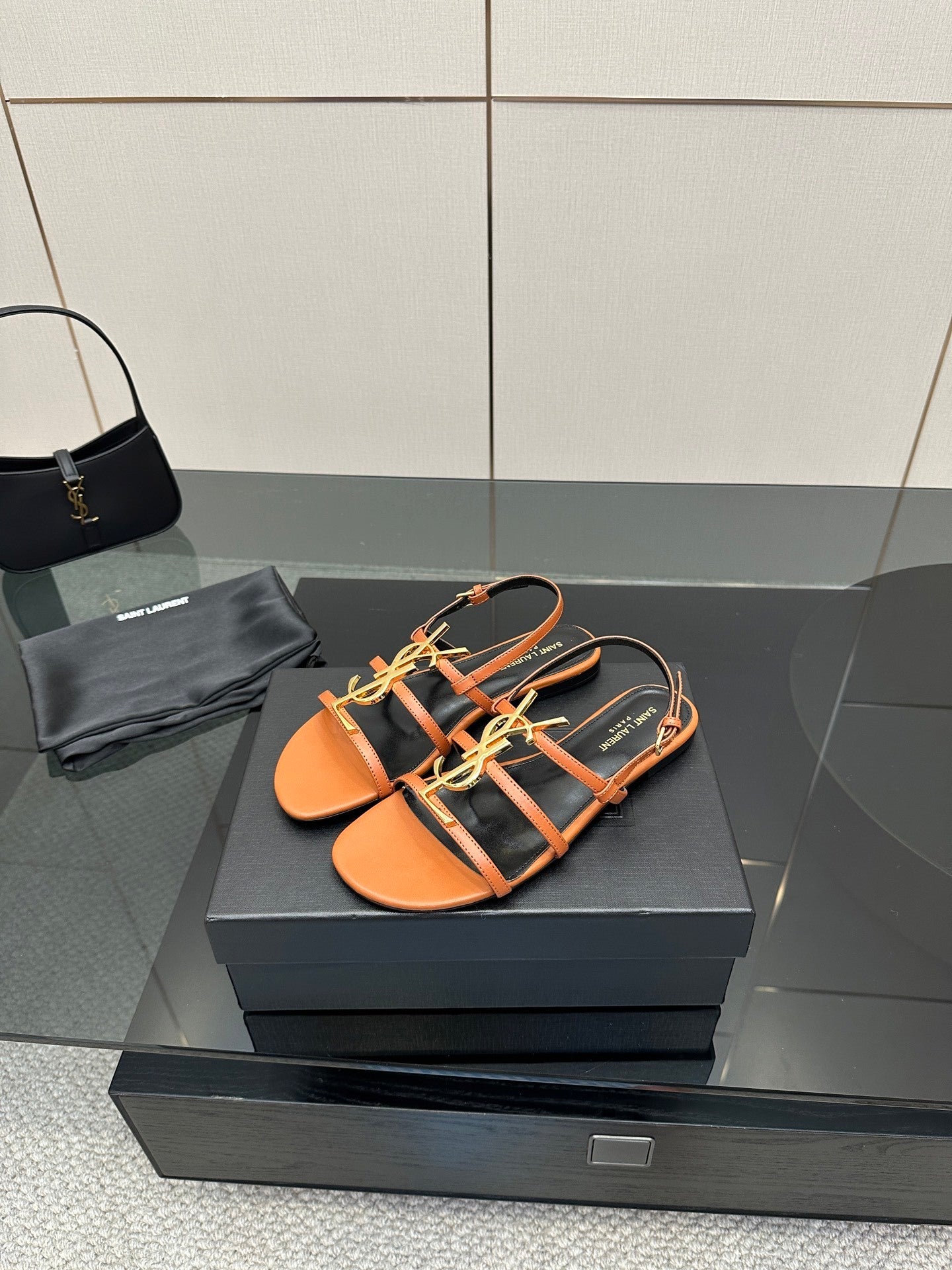 TAN STRAPPY FLAT SANDALS WITH GOLD LOGO DETAIL