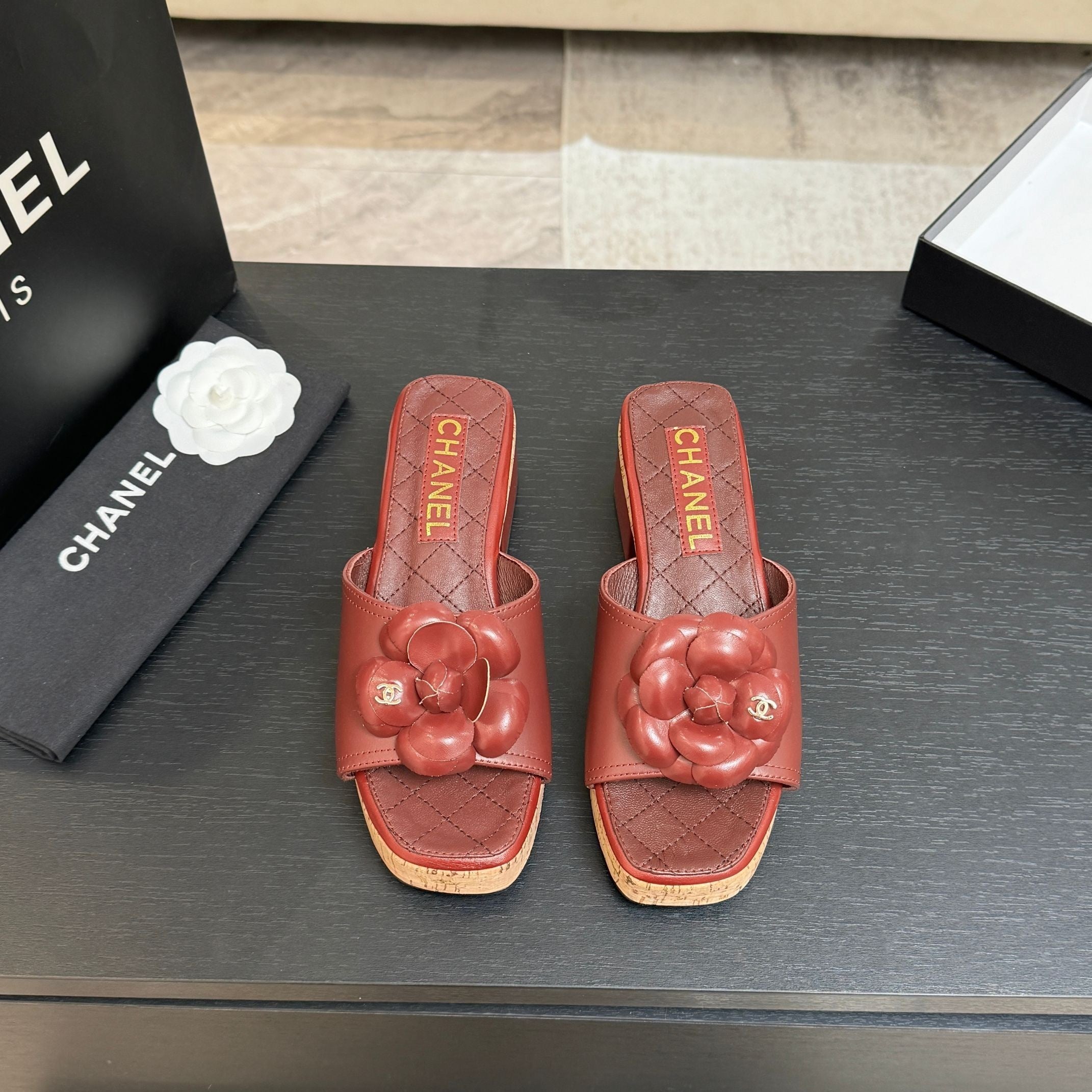 TERRACOTTA QUILTED PLATFORM SLIDE SANDALS WITH FLORAL DETAIL