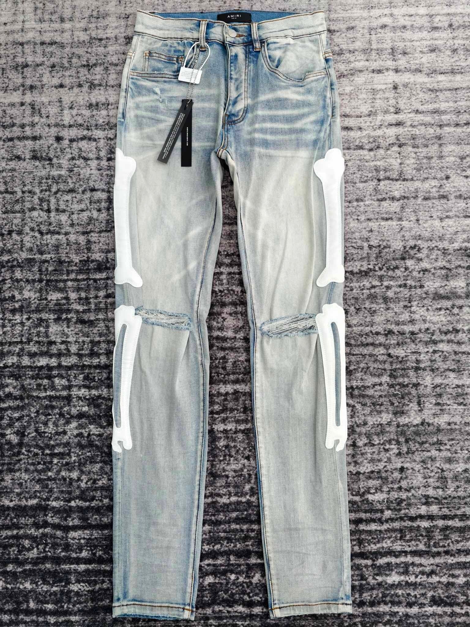 SKELETON APPLIQUÉ DISTRESSED SKINNY JEANS