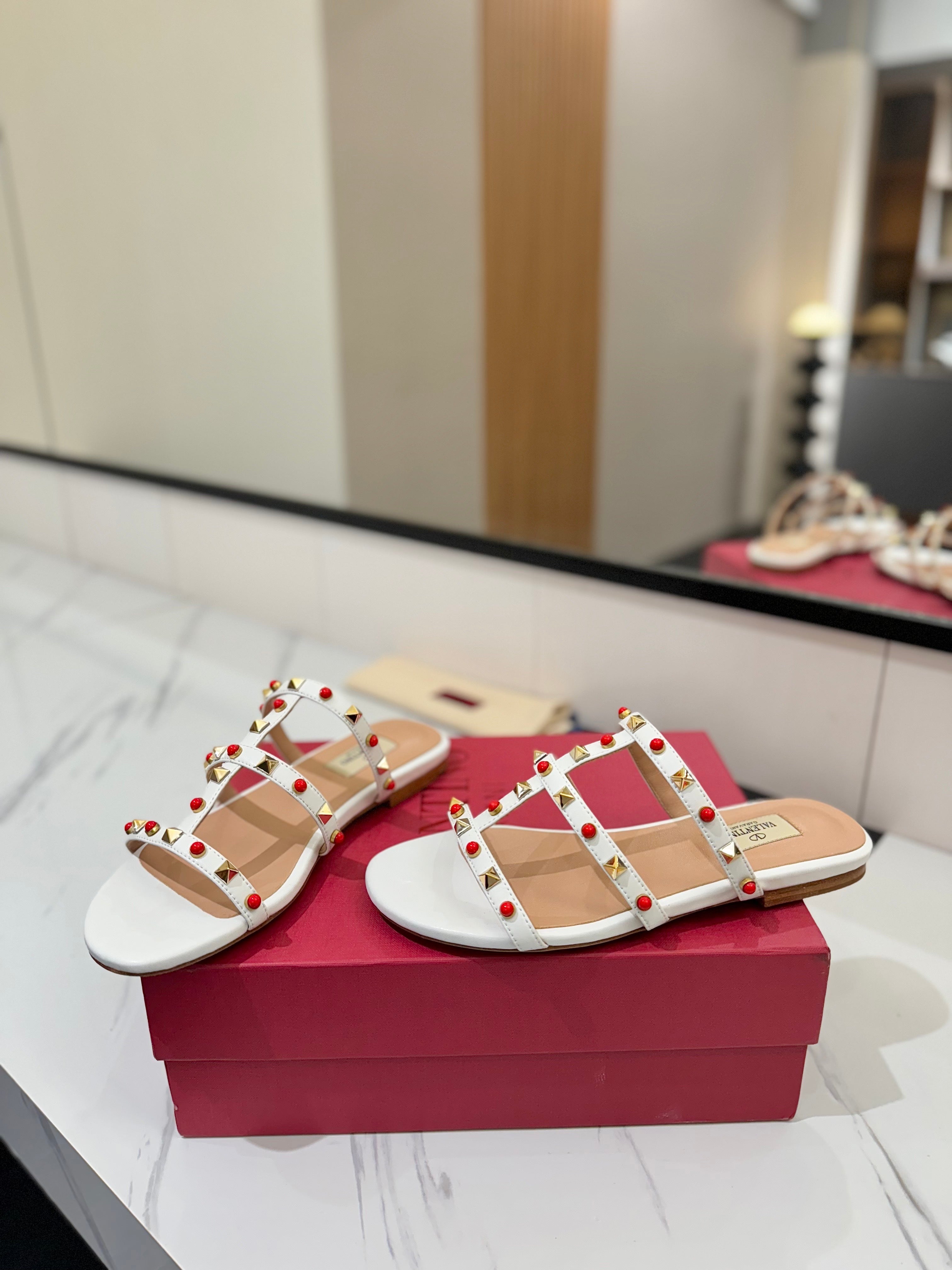 STUDDED STRAP FLAT SANDALS – WHITE WITH RED ACCENTS