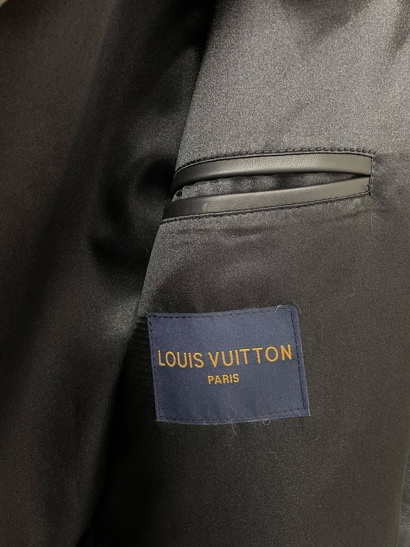 BLACK FAUX FUR HOODED JACKET WITH CONTRAST PATTERN