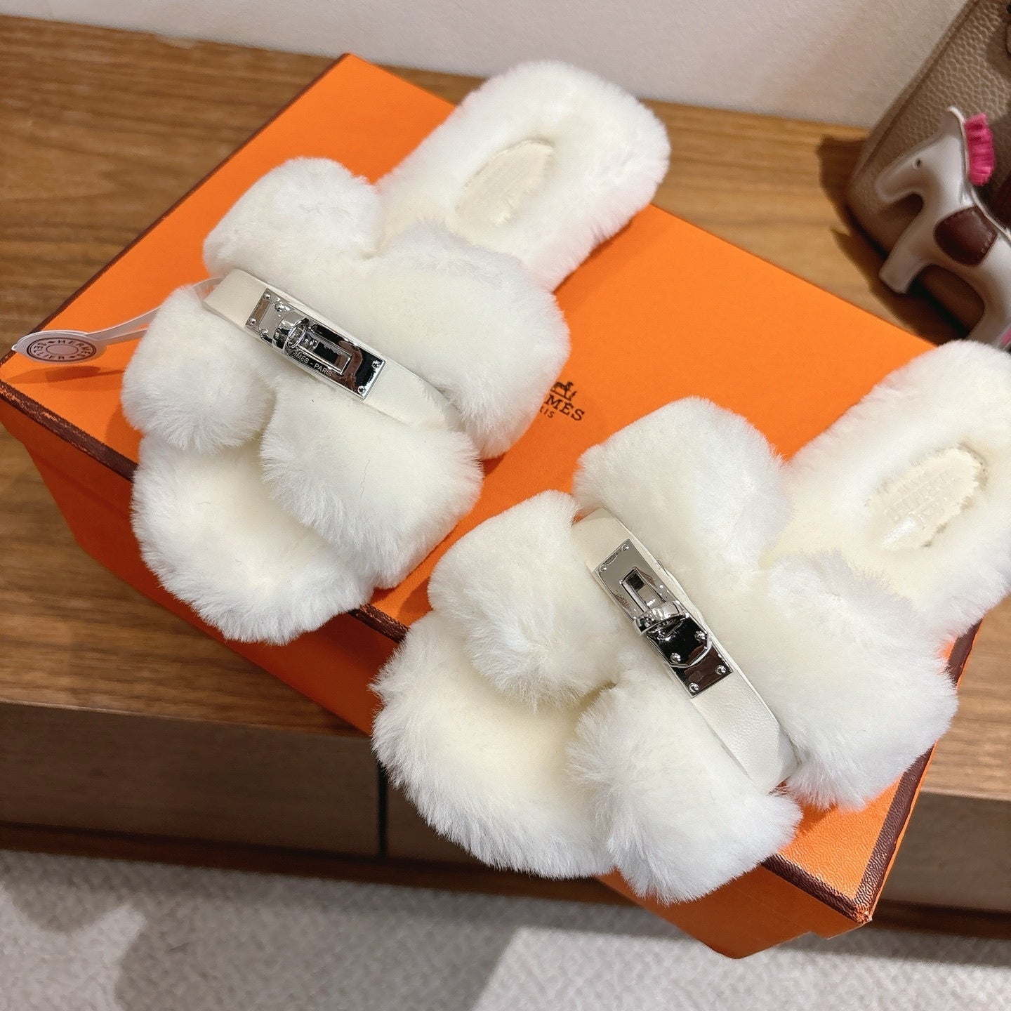 IVORY FAUX FUR MULE SLIPPERS WITH SILVER-TONE ACCENT