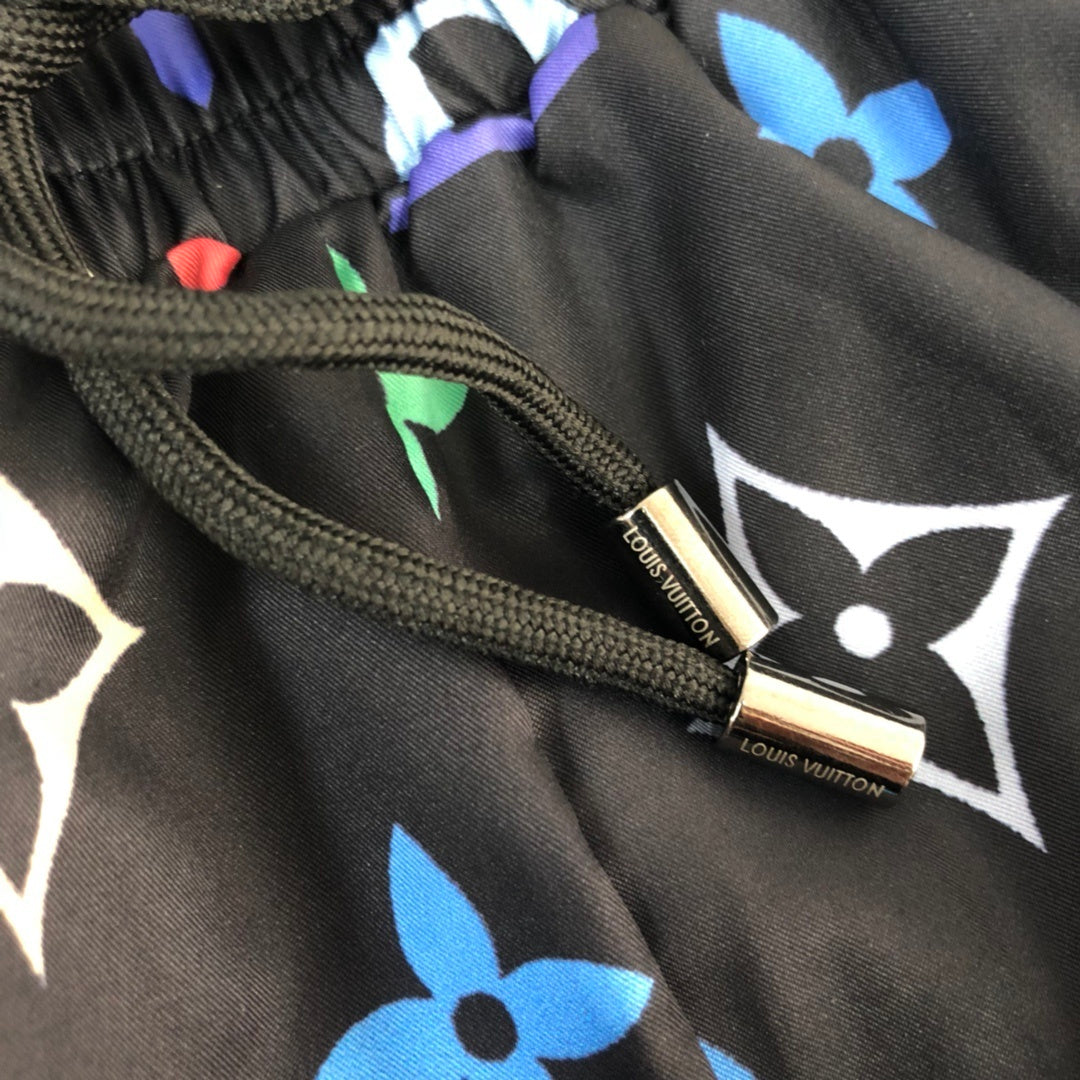 BLACK MULTICOLOR PRINT SWIM SHORTS