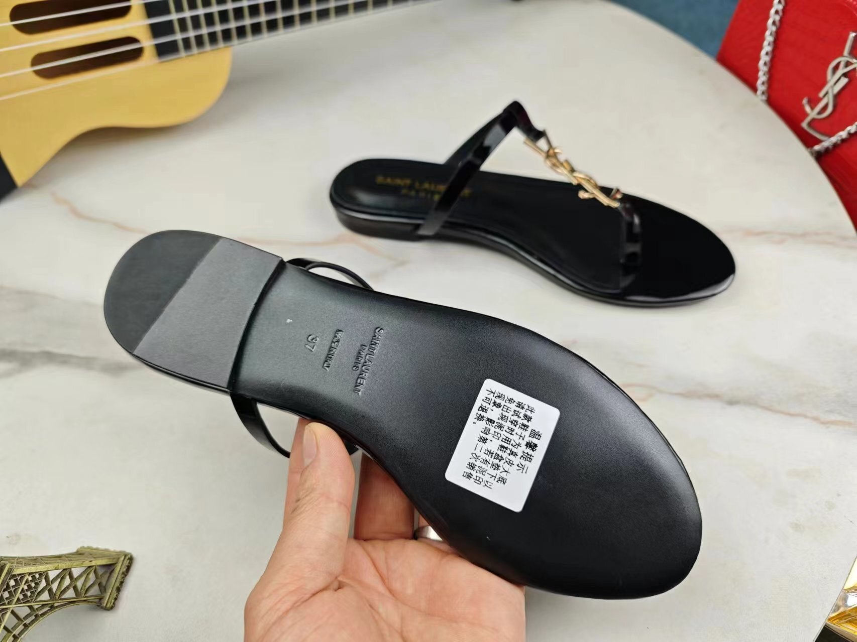 BLACK SLIDE SANDALS WITH GOLD DETAIL