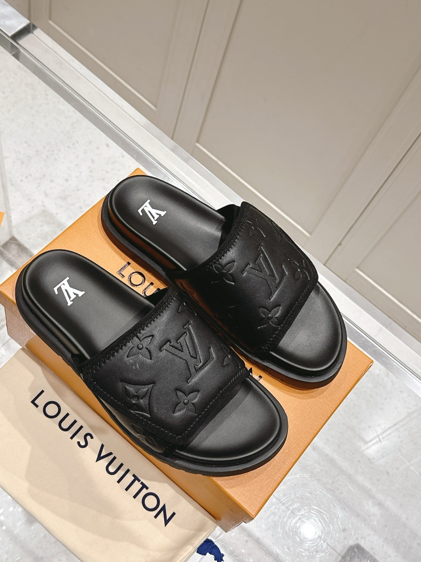 BLACK EMBOSSED SLIDE SANDALS