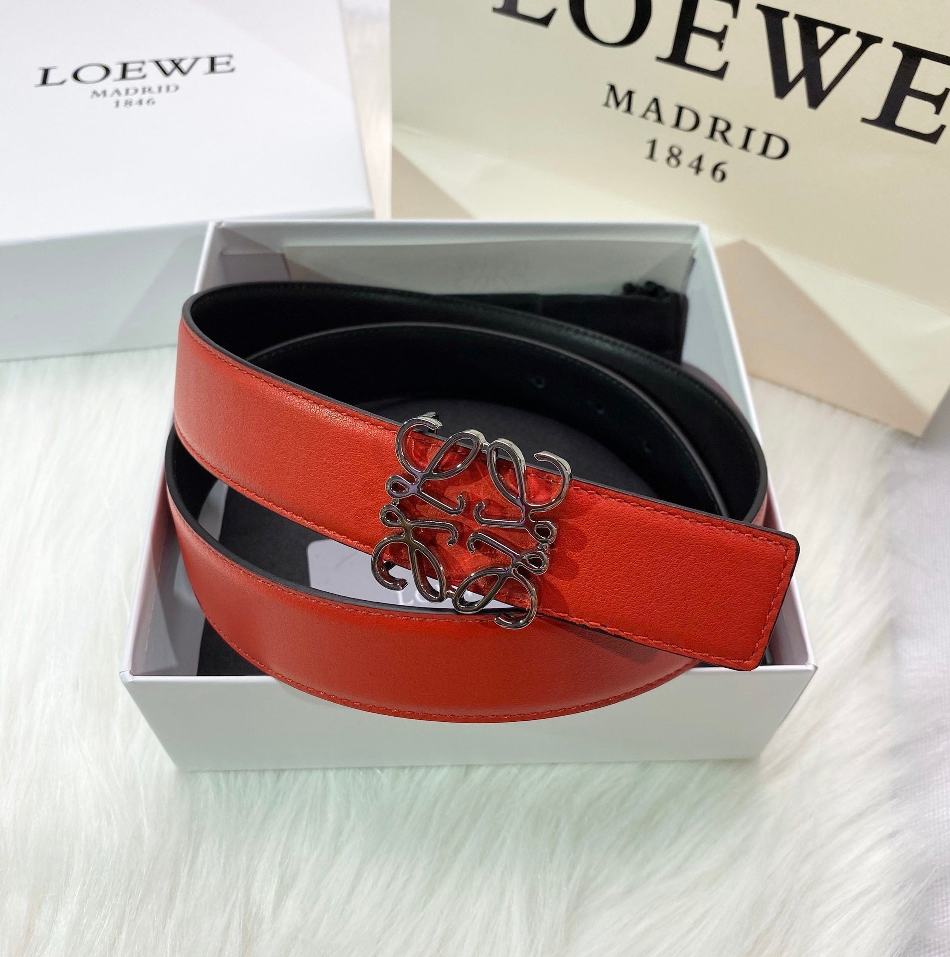 RED LEATHER BELT WITH SILVER ANAGRAM BUCKLE