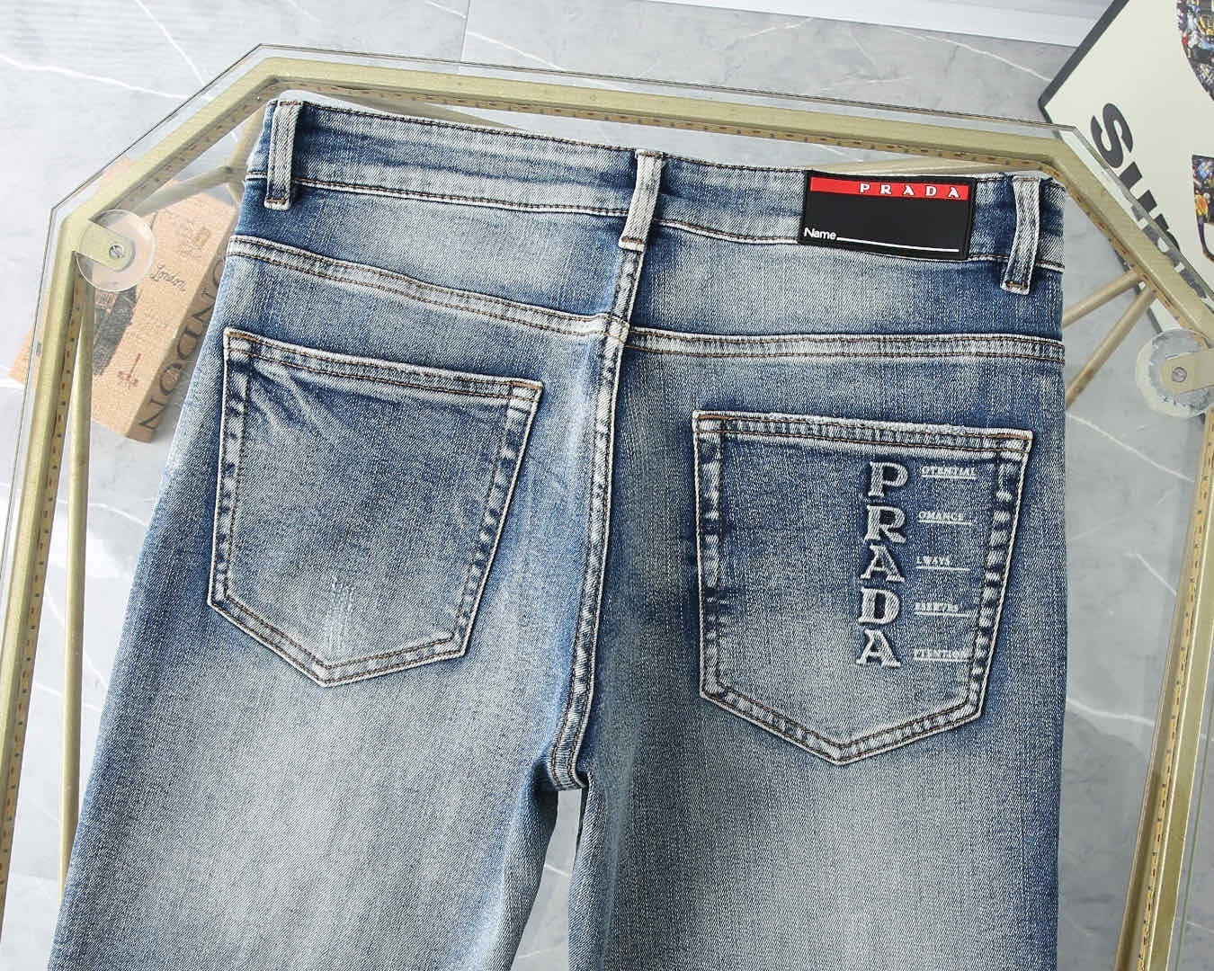 LIGHT WASH EMBROIDERED LOGO DENIM JEANS