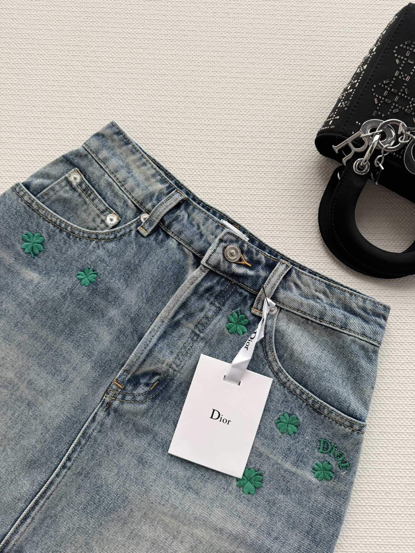 BLUE DENIM MINI SKIRT WITH FLORAL EMBROIDERY
