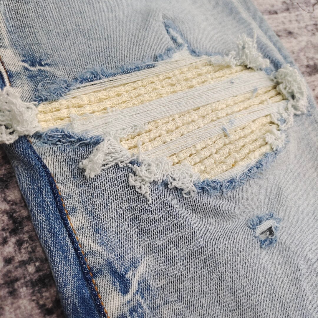 DISTRESSED LOGO PATCH SKINNY JEANS