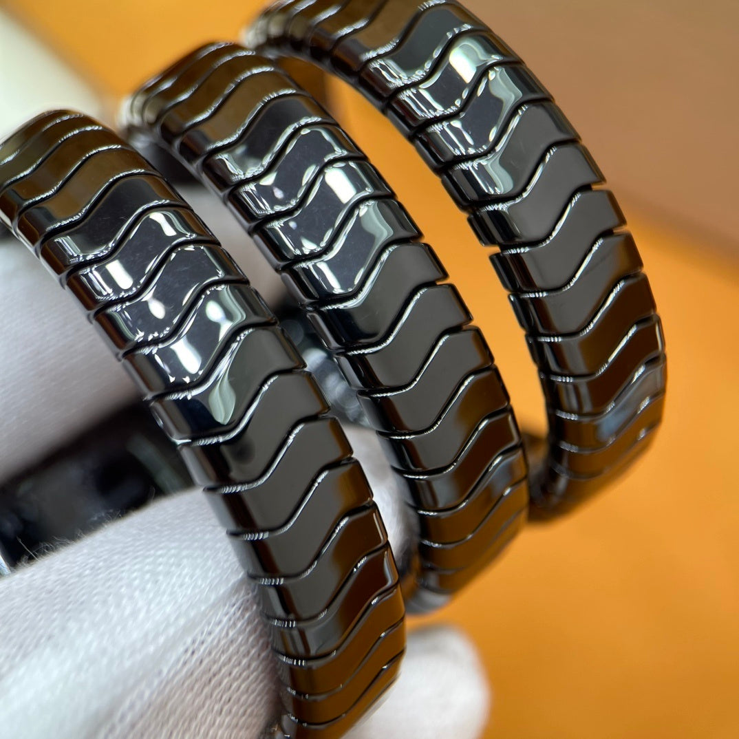 SERPENT WRAP WATCH – BLACK & GOLD ELEGANCE