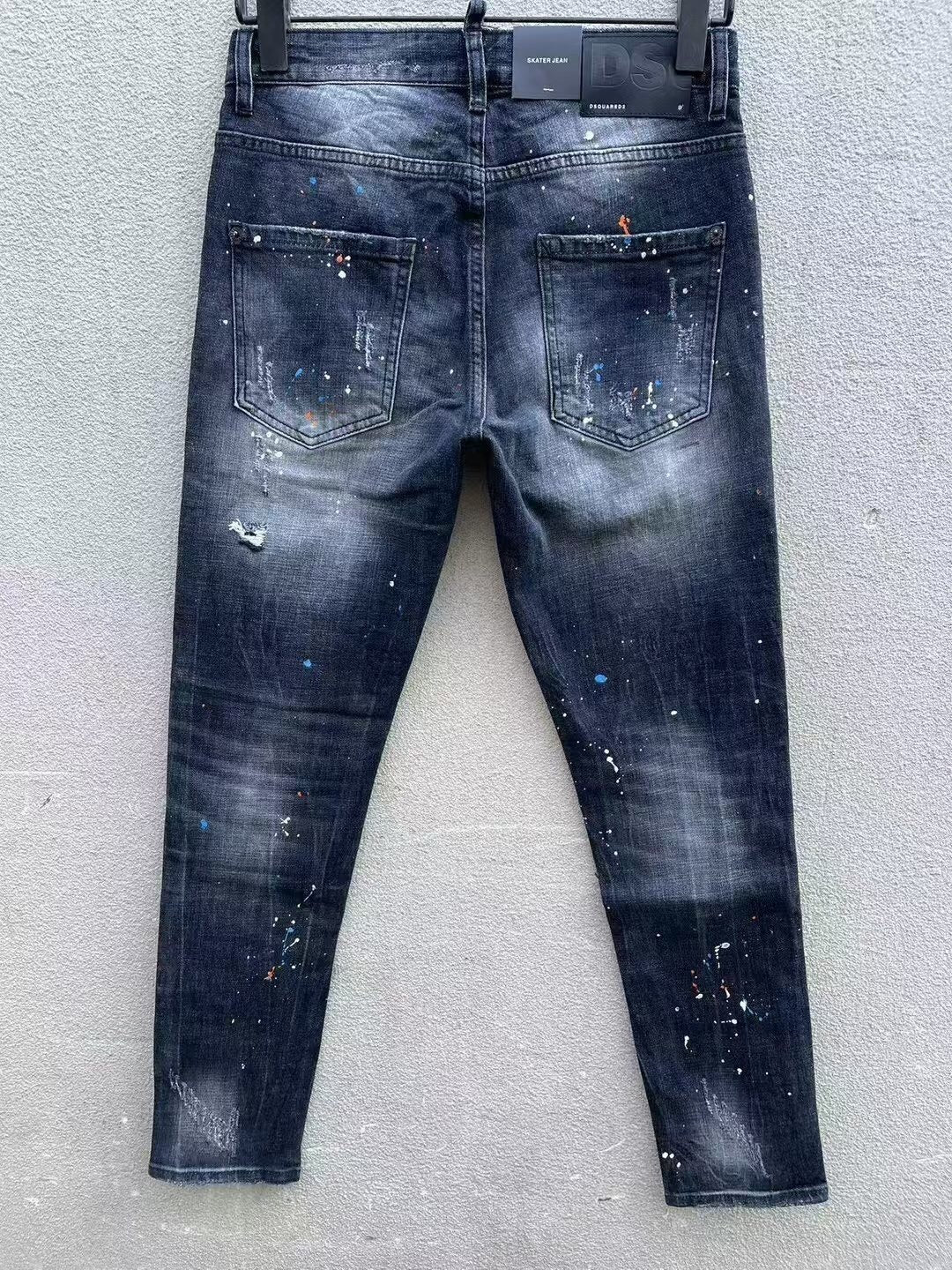 DISTRESSED PAINT SPLATTER SLIM JEANS WITH MAPLE GRAPHIC