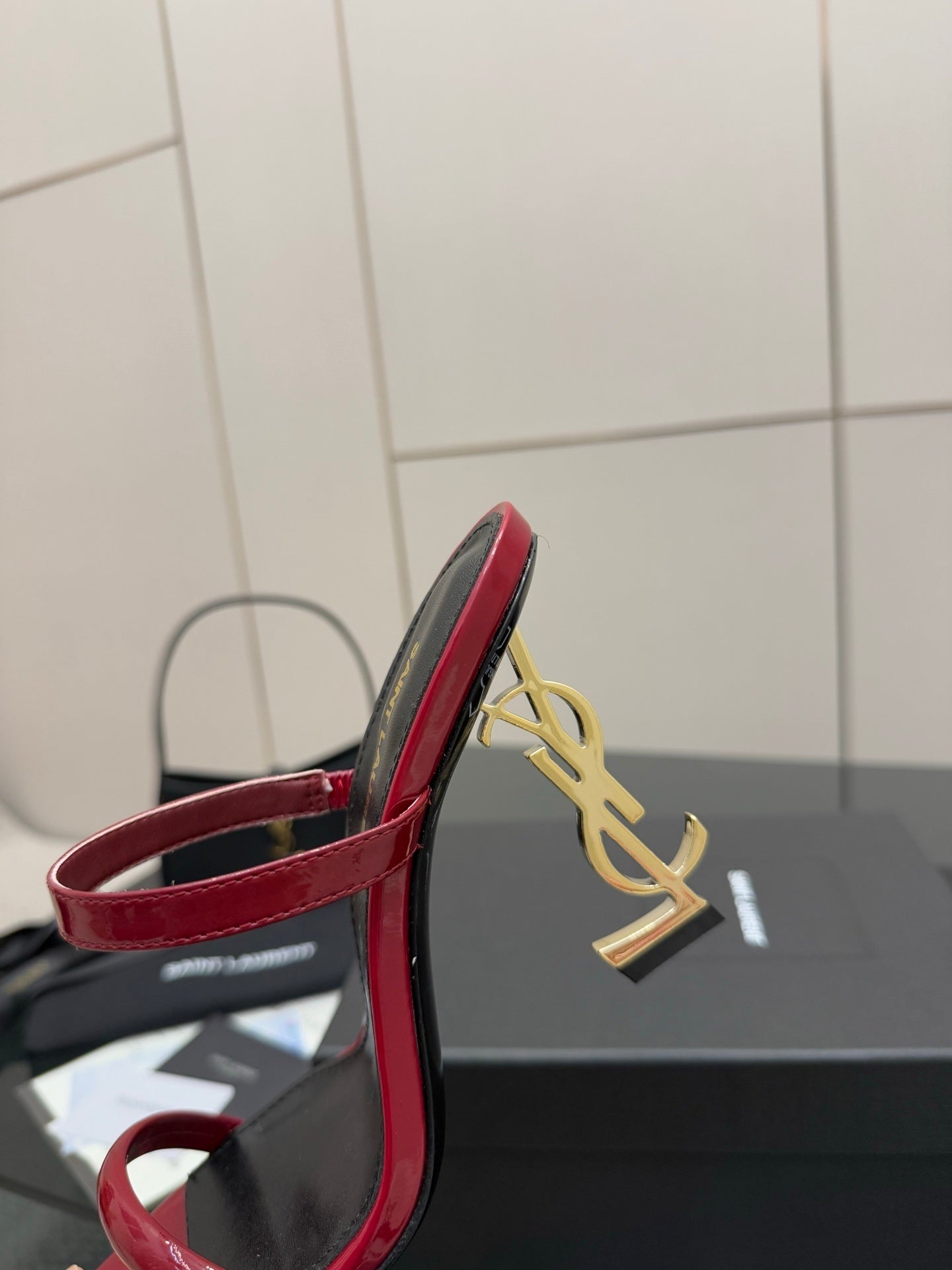 GLOSSY RED STRAPPY HEELS WITH GOLD LOGO HEEL