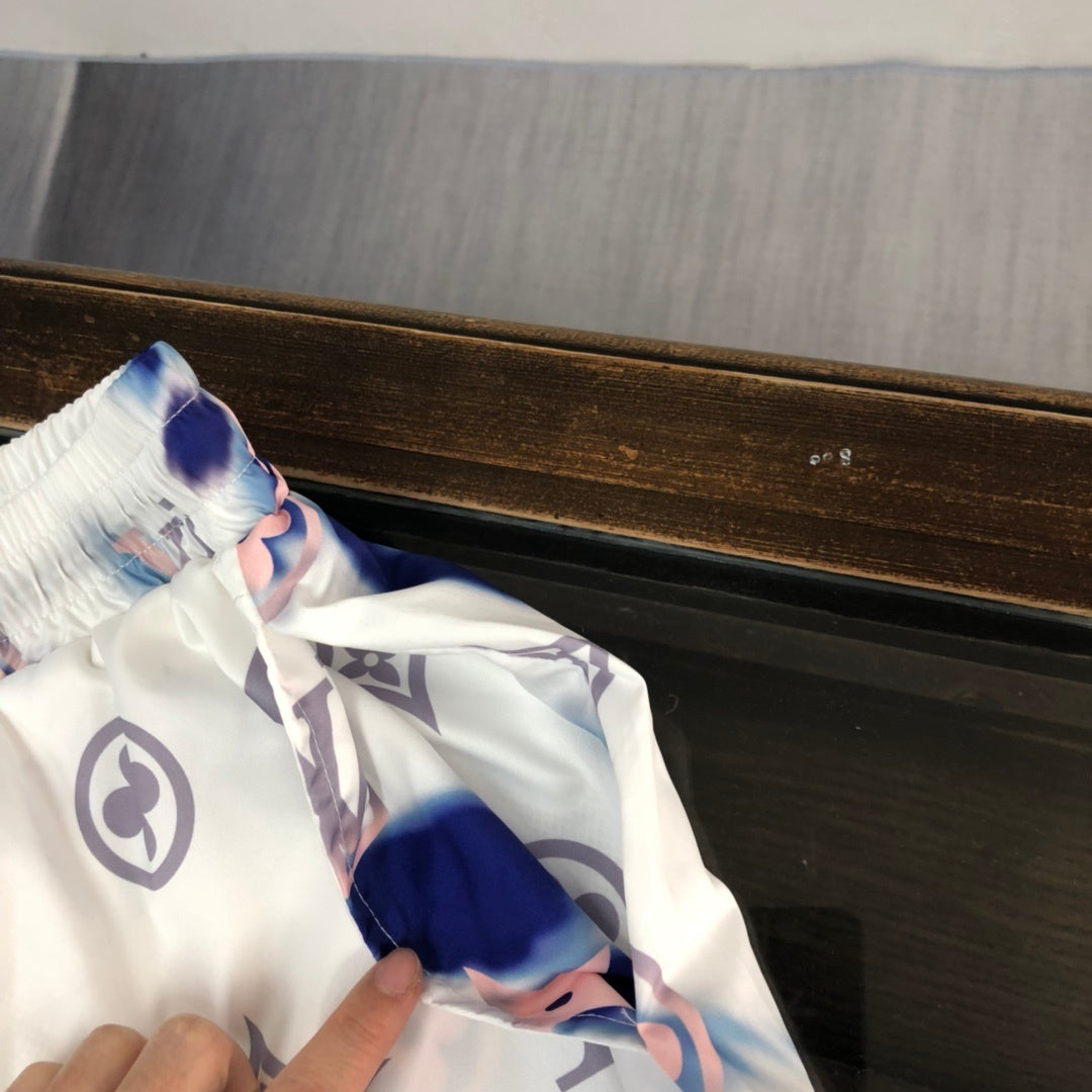 WHITE TIE-DYE PRINT SWIM SHORTS