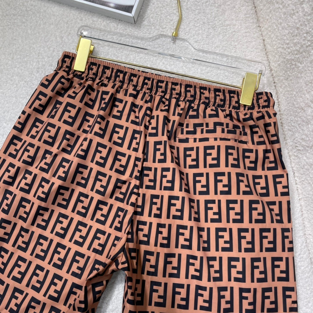 MONOGRAM SWIM SHORTS – BROWN