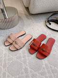 FLAT SUMMER SLIDES WITH CLEAN STRAP AND METAL DETAIL