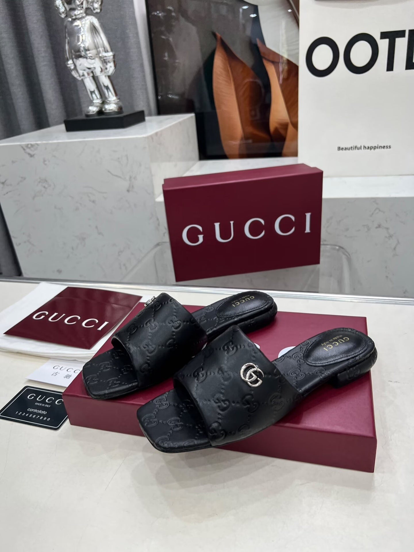 BLACK EMBOSSED LOGO SLIDE SANDALS WITH METAL DETAIL