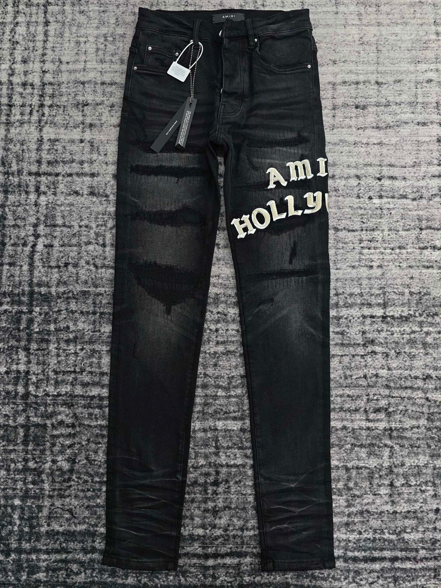 DISTRESSED LOGO APPLIQUÉ SKINNY JEANS