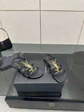 BLACK STRAPPY FLAT SANDALS WITH GOLD LOGO DETAIL